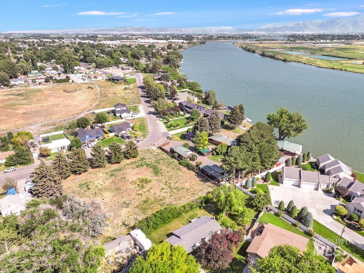 Aerial overview of property's location featuring nearby suburban area and a large body of water