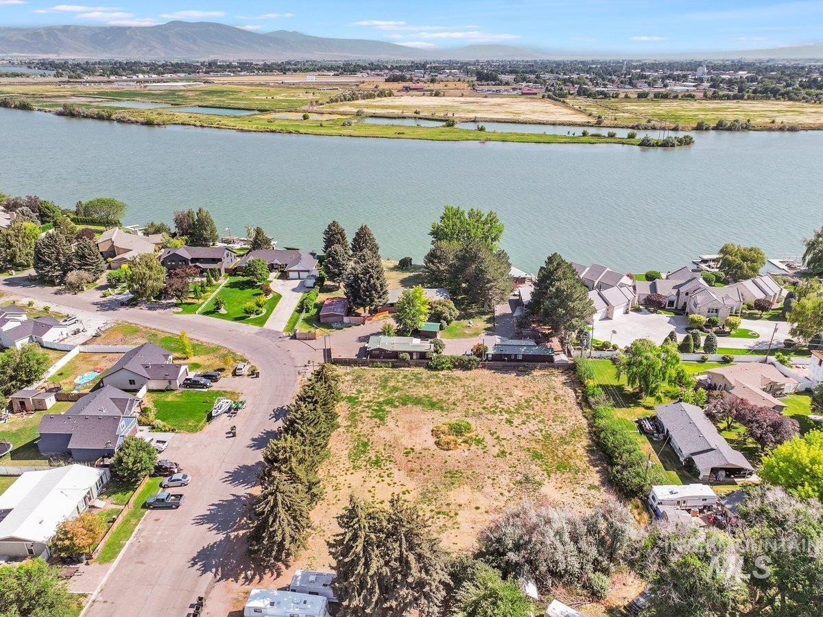 Aerial view of residential area featuring a water and mountain view