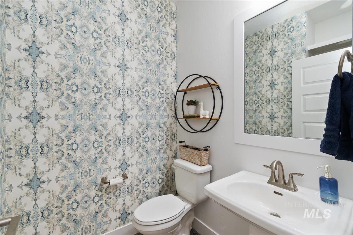 Half bath with toilet and a sink