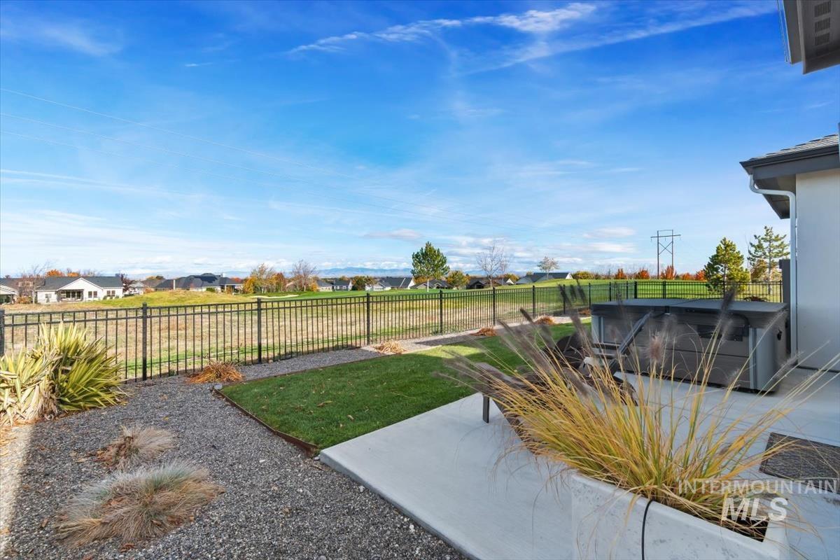 Fenced backyard with a patio area
