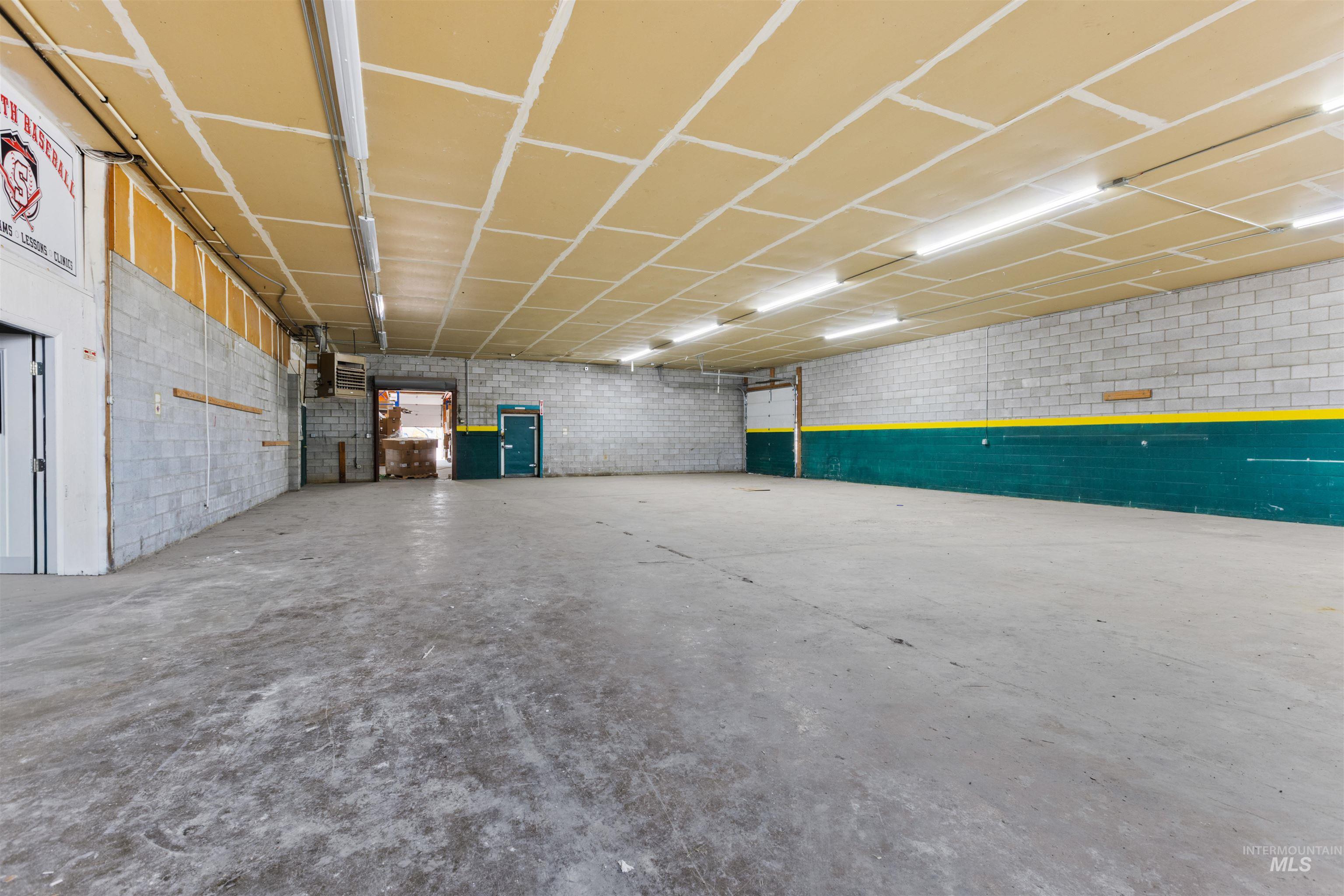 Garage featuring a heating unit