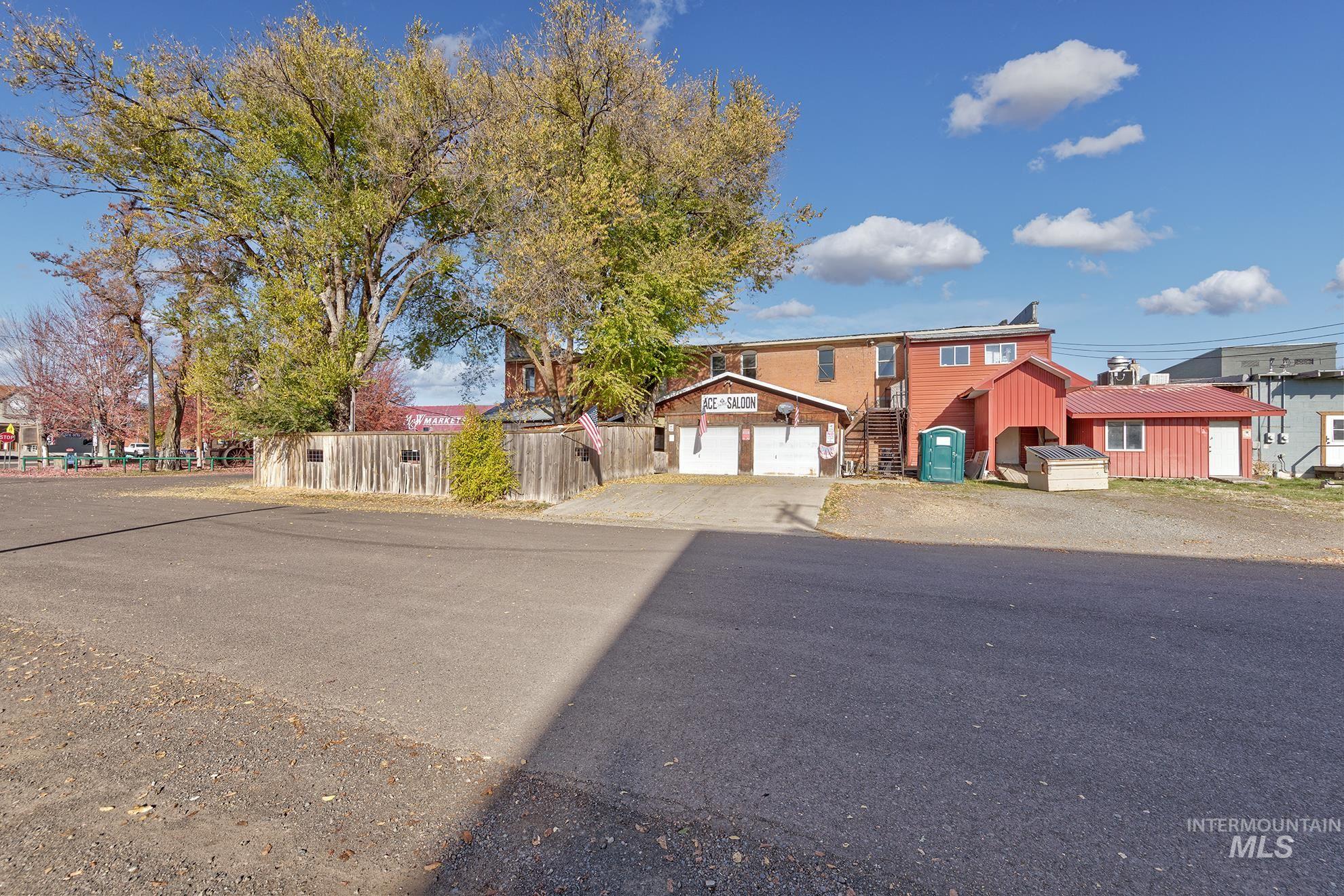 View of front of house with stairway and driveway
