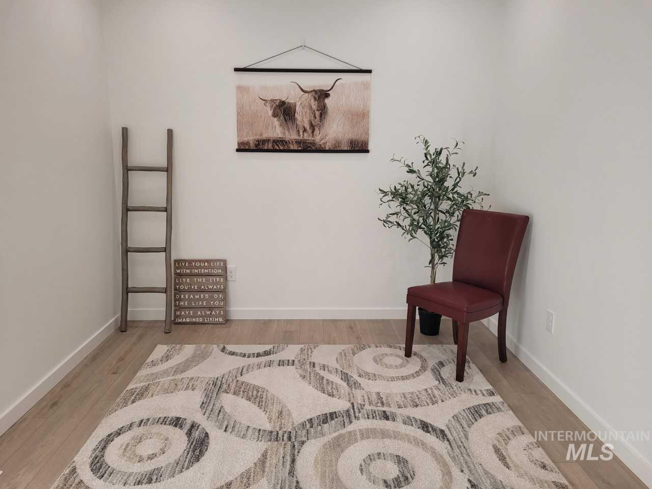Sitting room with light wood-style floors