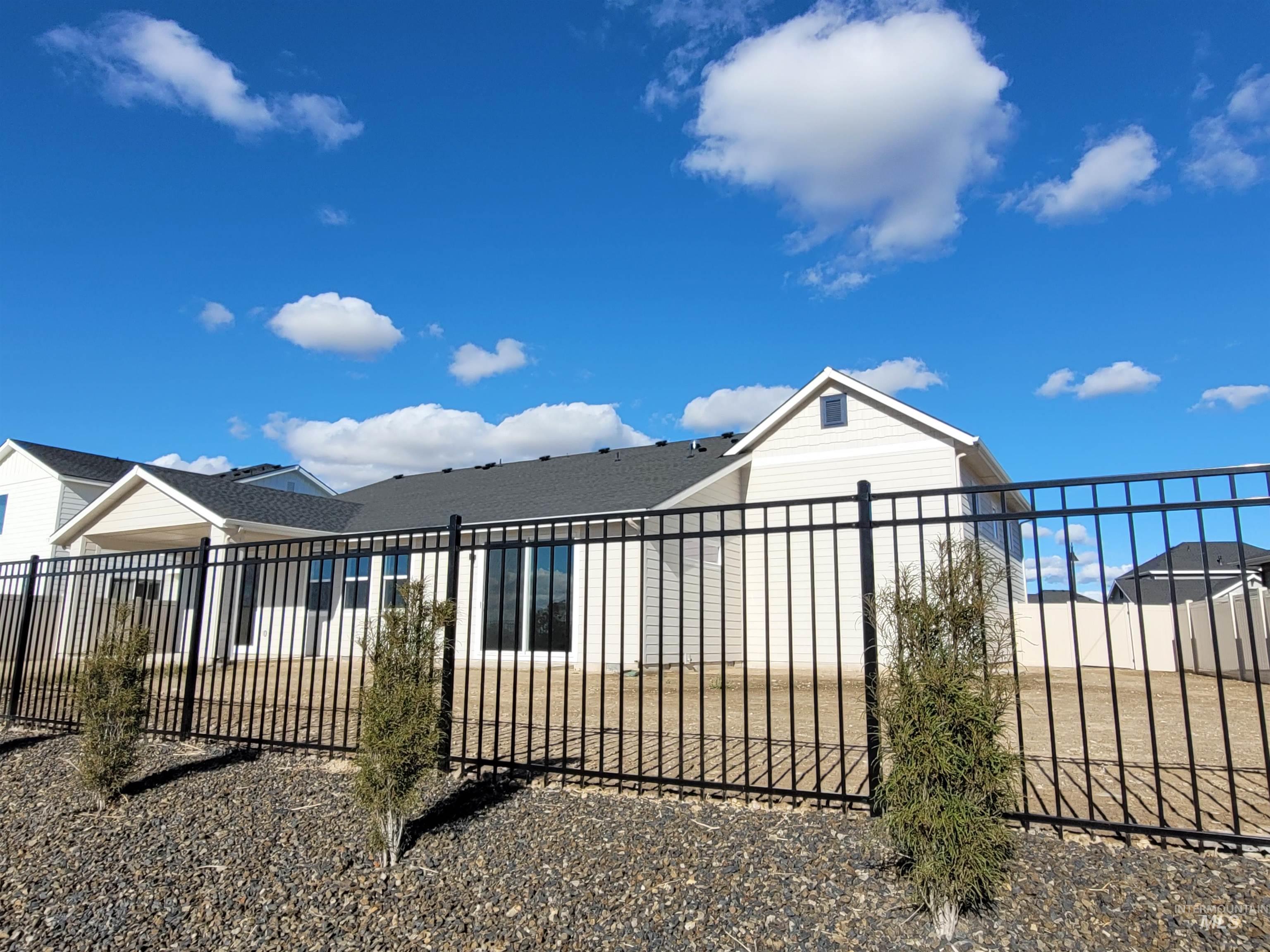 Back of house with a patio