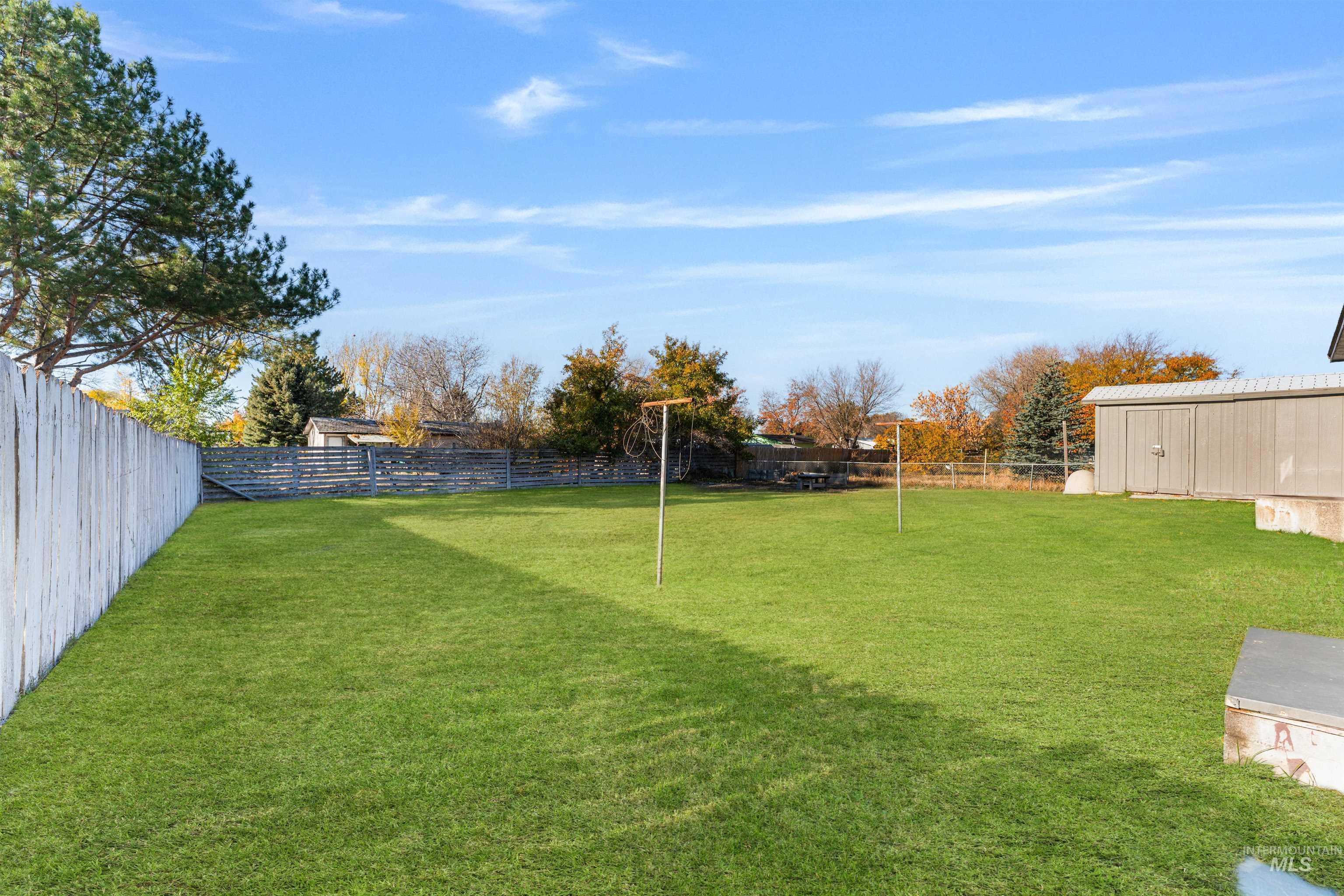View of fenced backyard