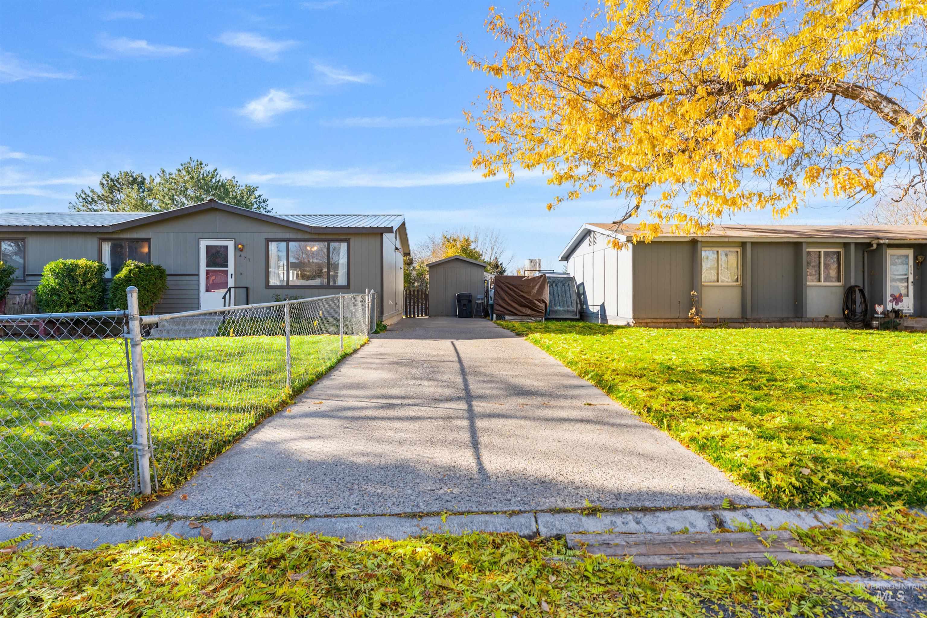 View of front of home featuring a metal roof and an outdoor structure