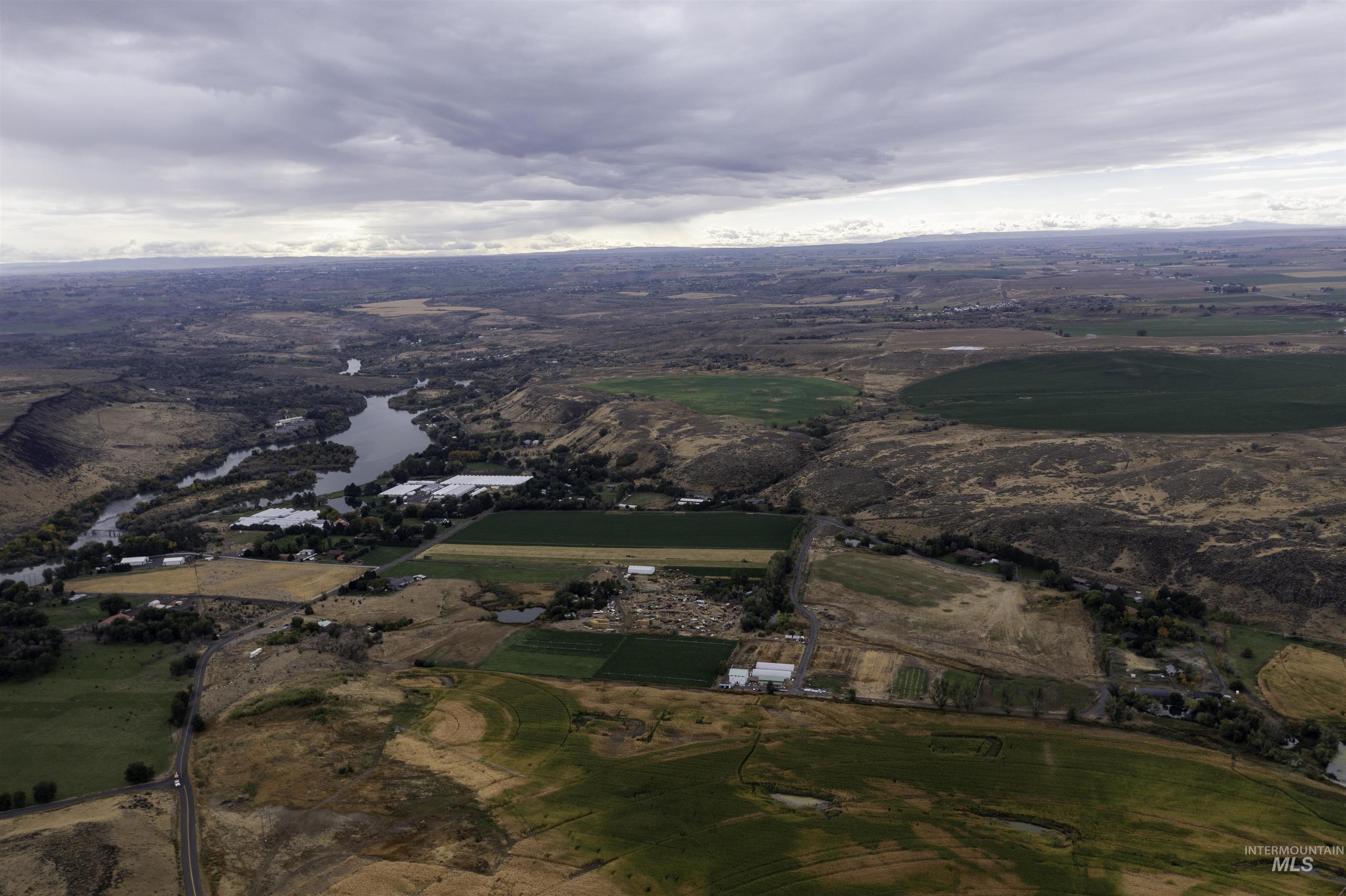 Aerial view of property's location featuring a large body of water