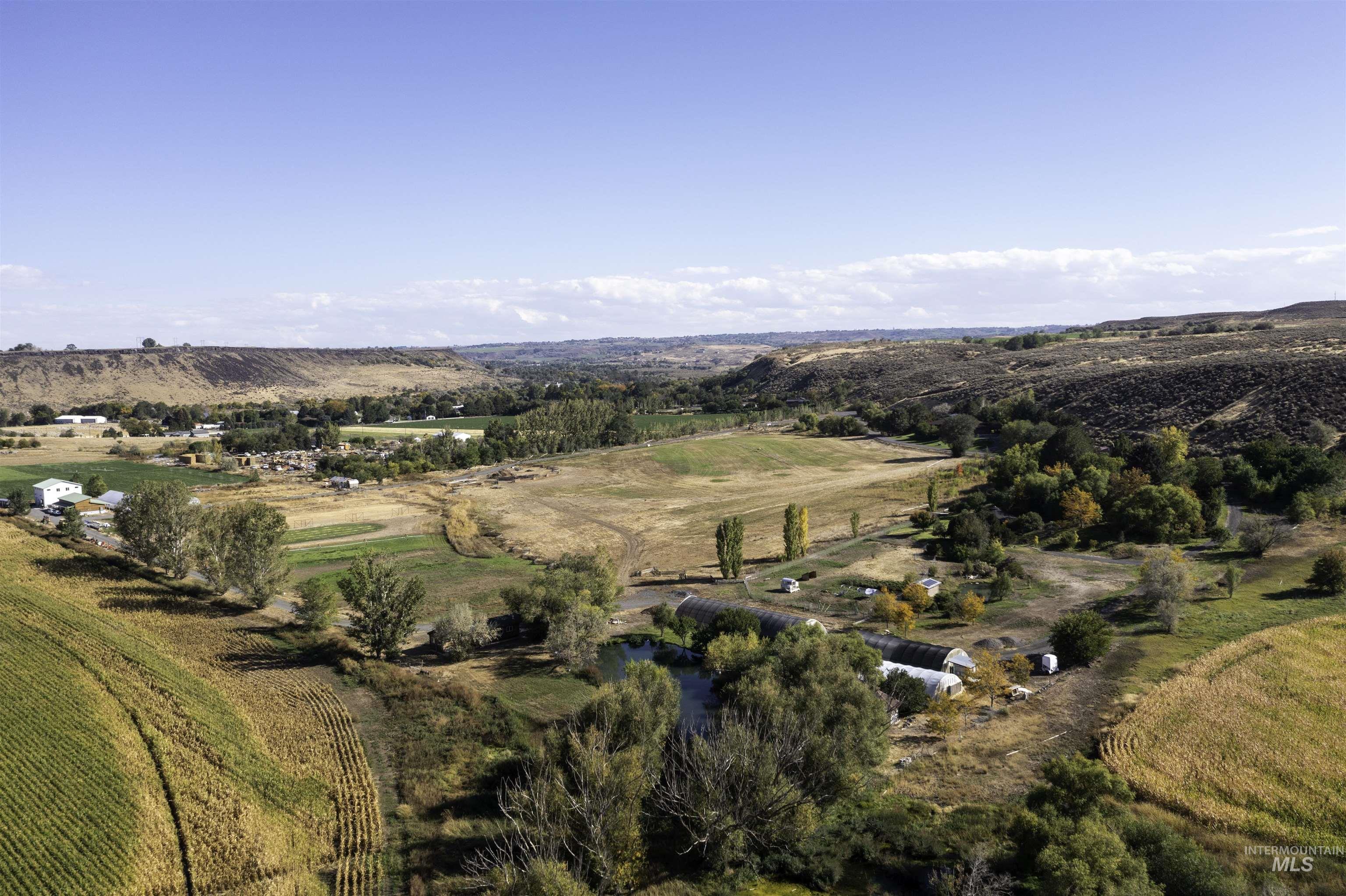 Aerial view of property and surrounding area with rural landscape