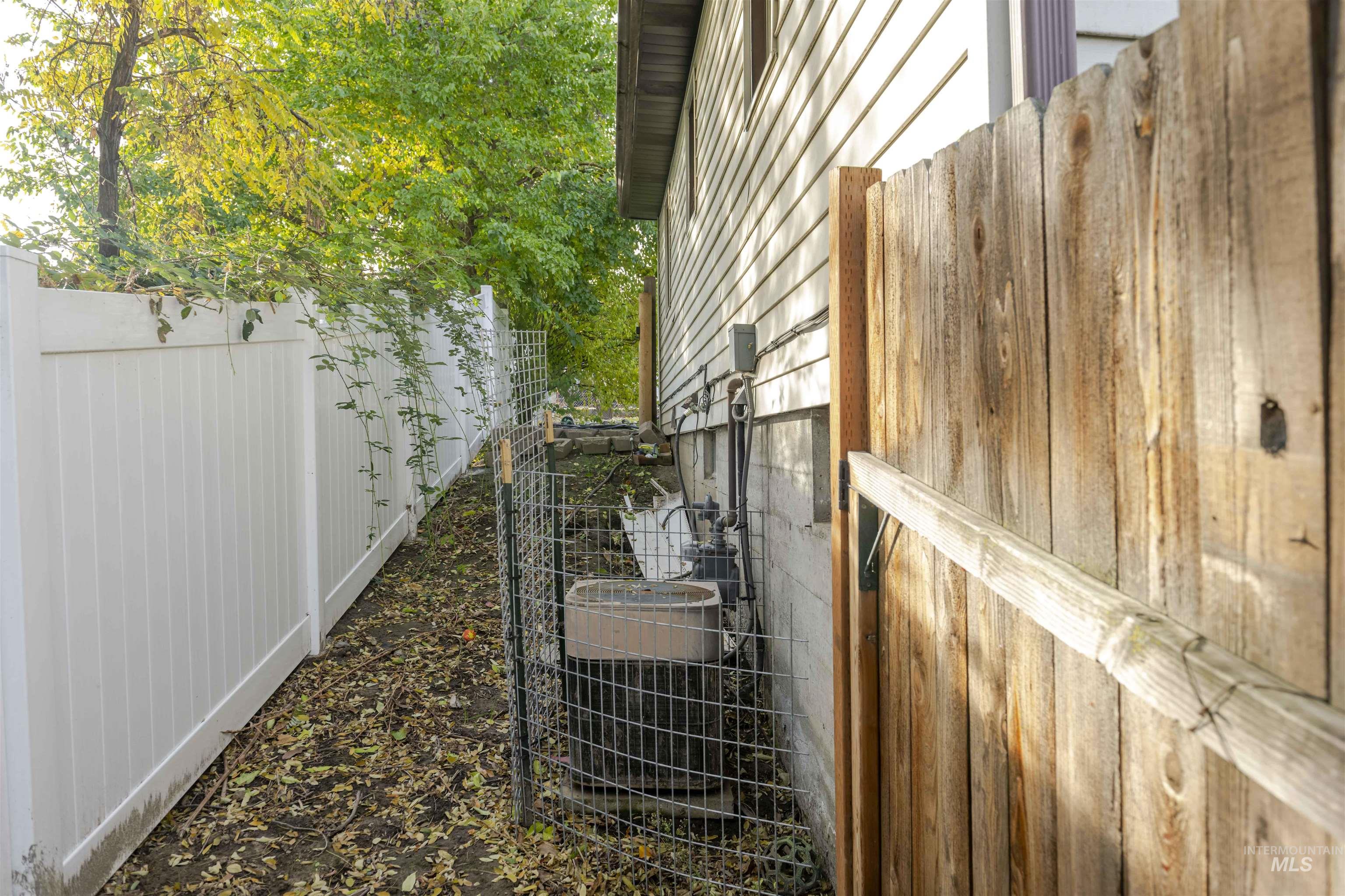 View of side of home featuring a central AC unit