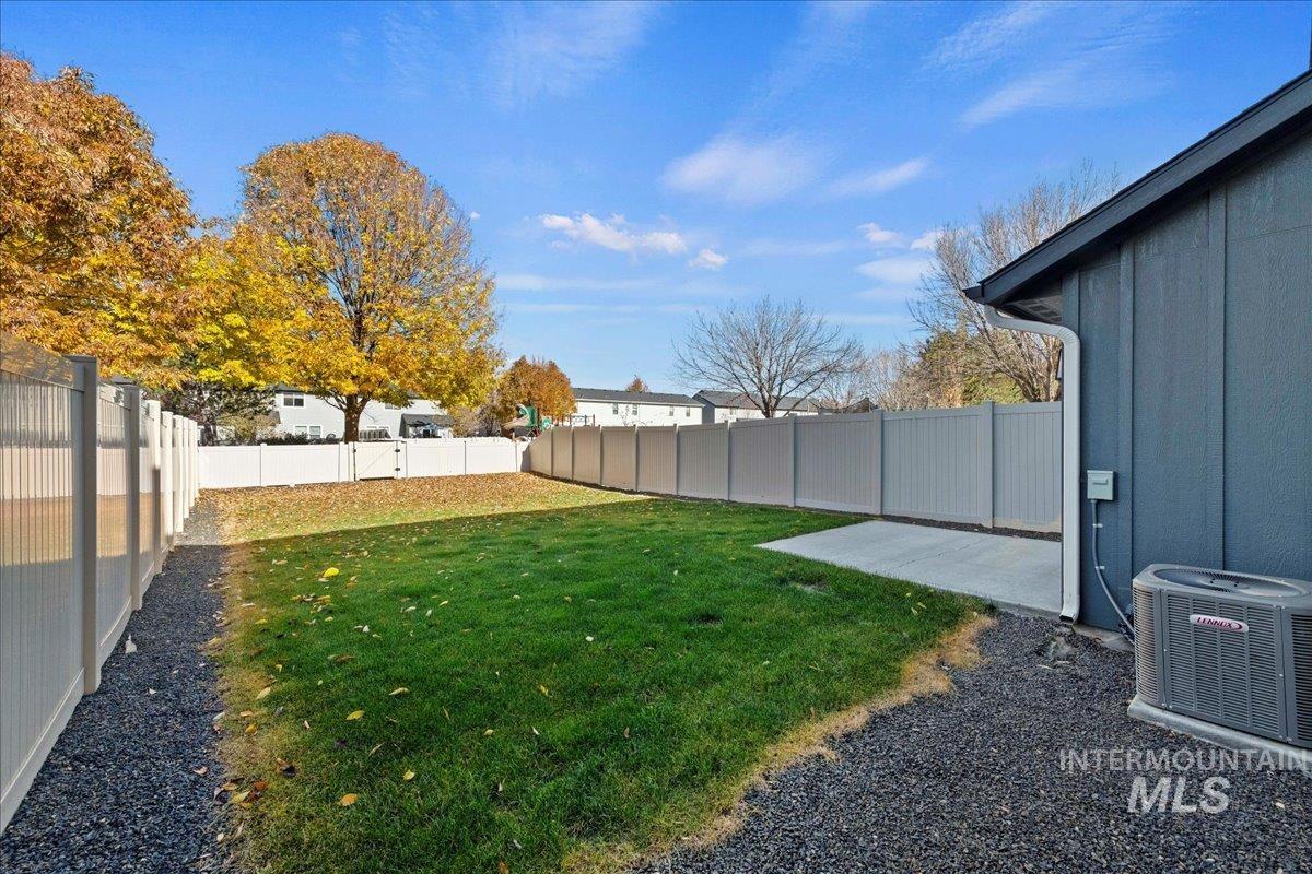View of fenced backyard