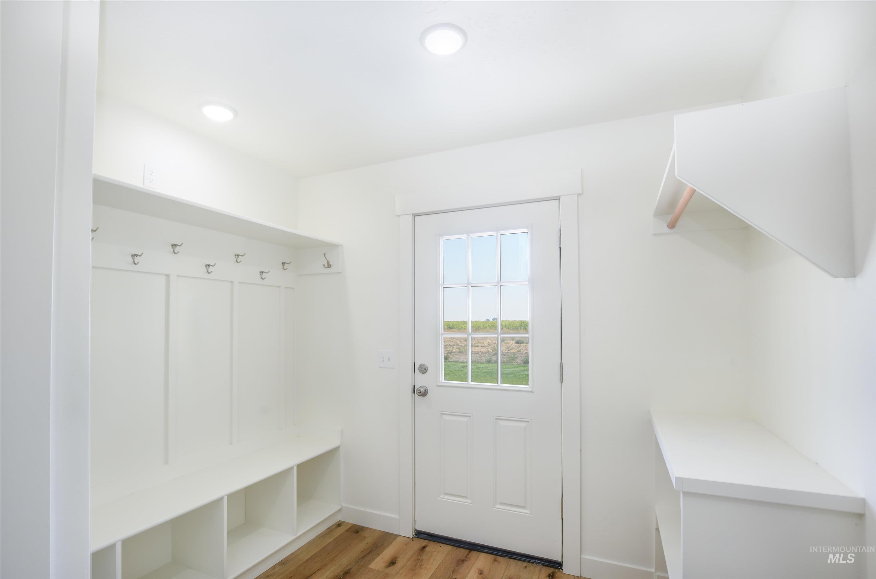 Mudroom with light wood-type flooring and recessed lighting