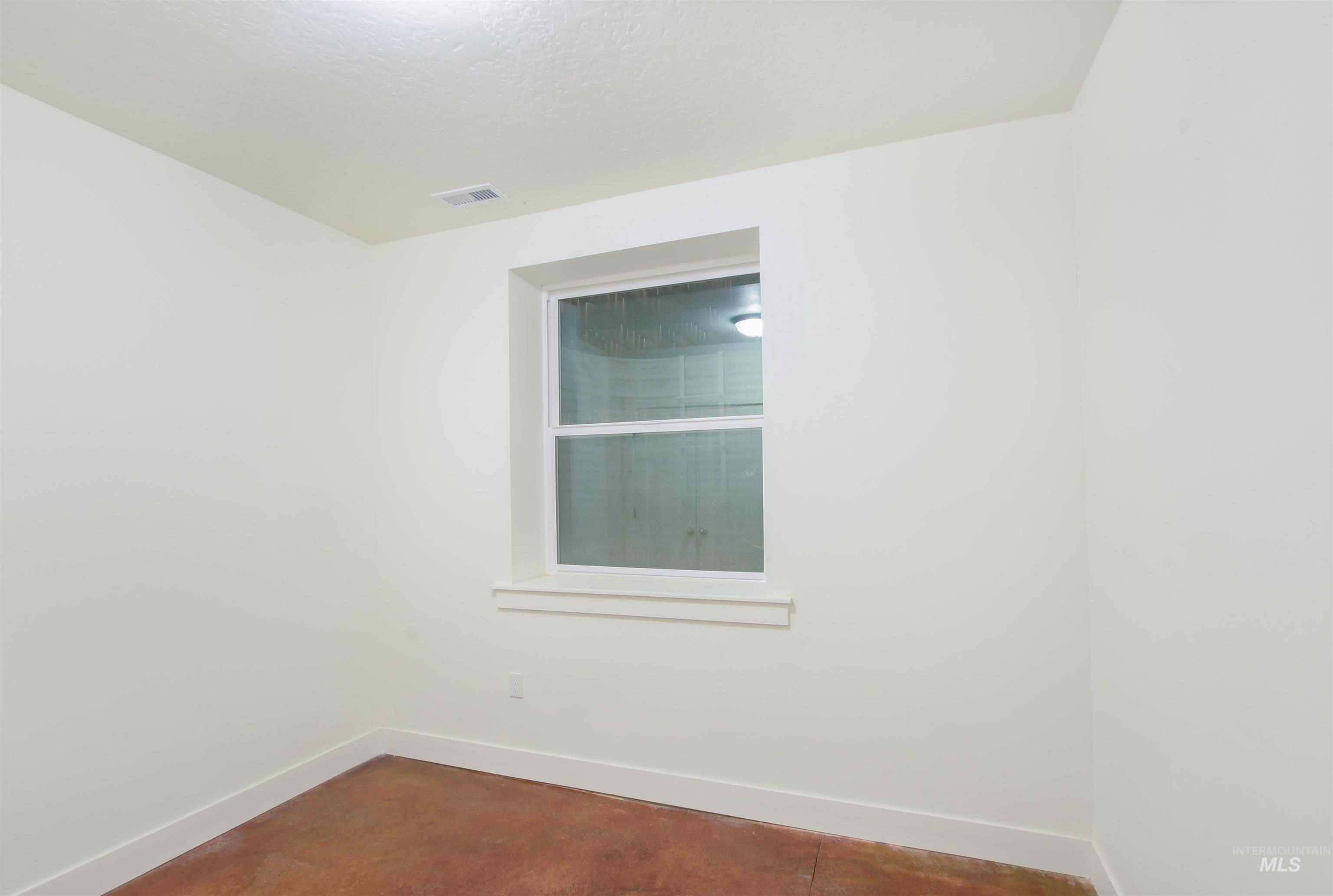 Spare room with baseboards