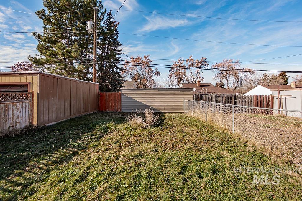 View of fenced backyard