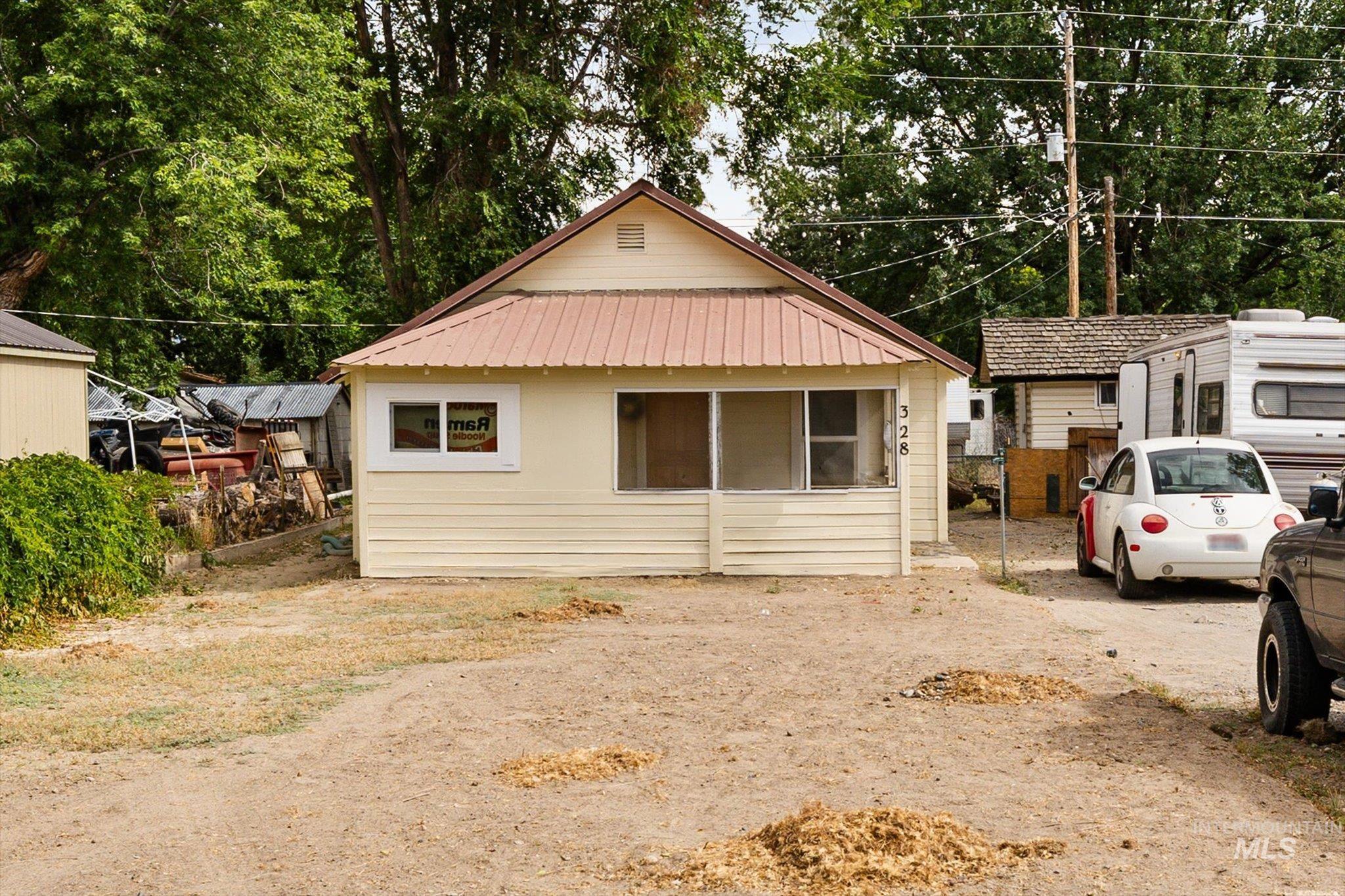 View of front of home featuring a metal roof
