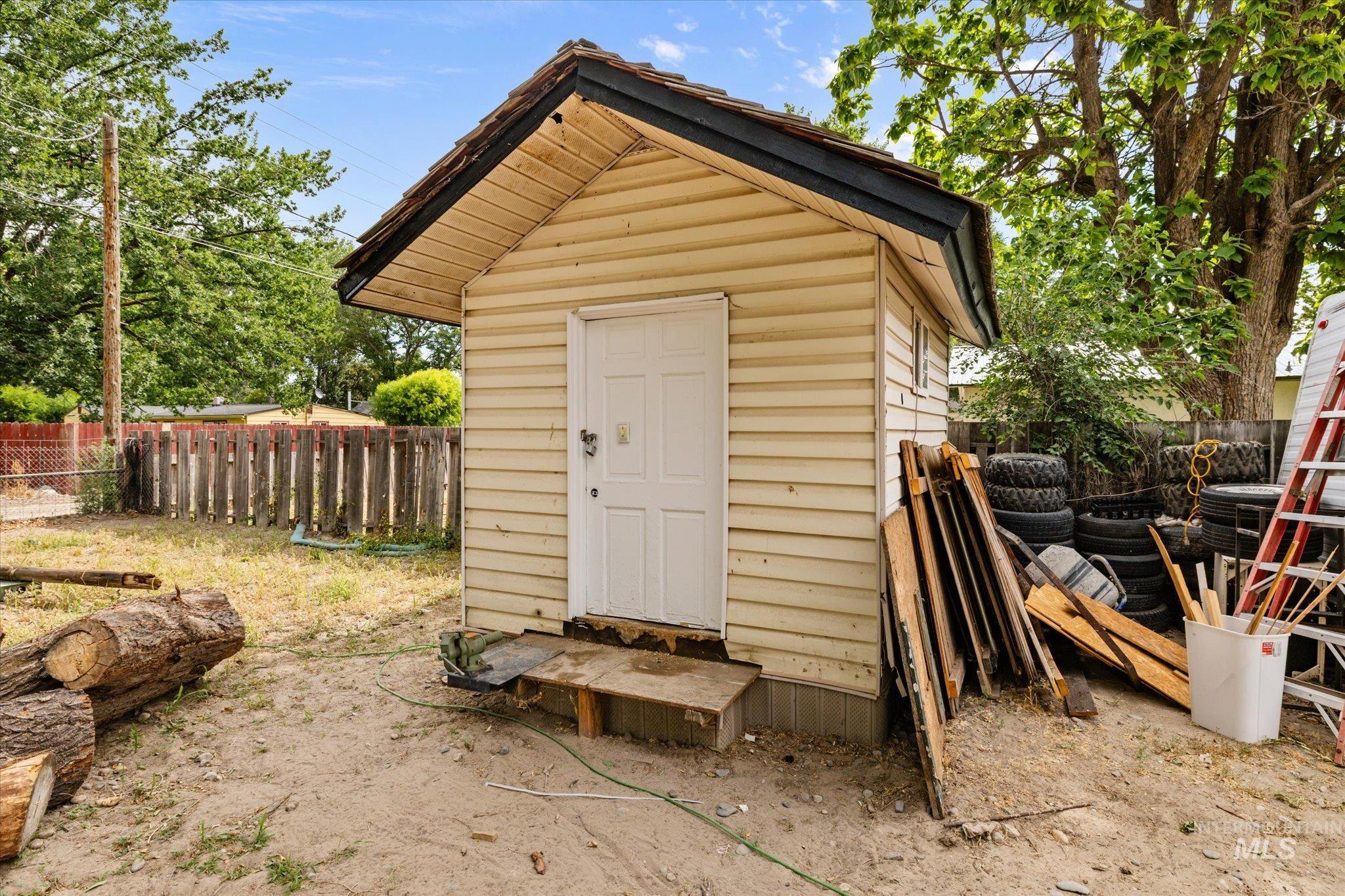 View of shed with a fenced backyard