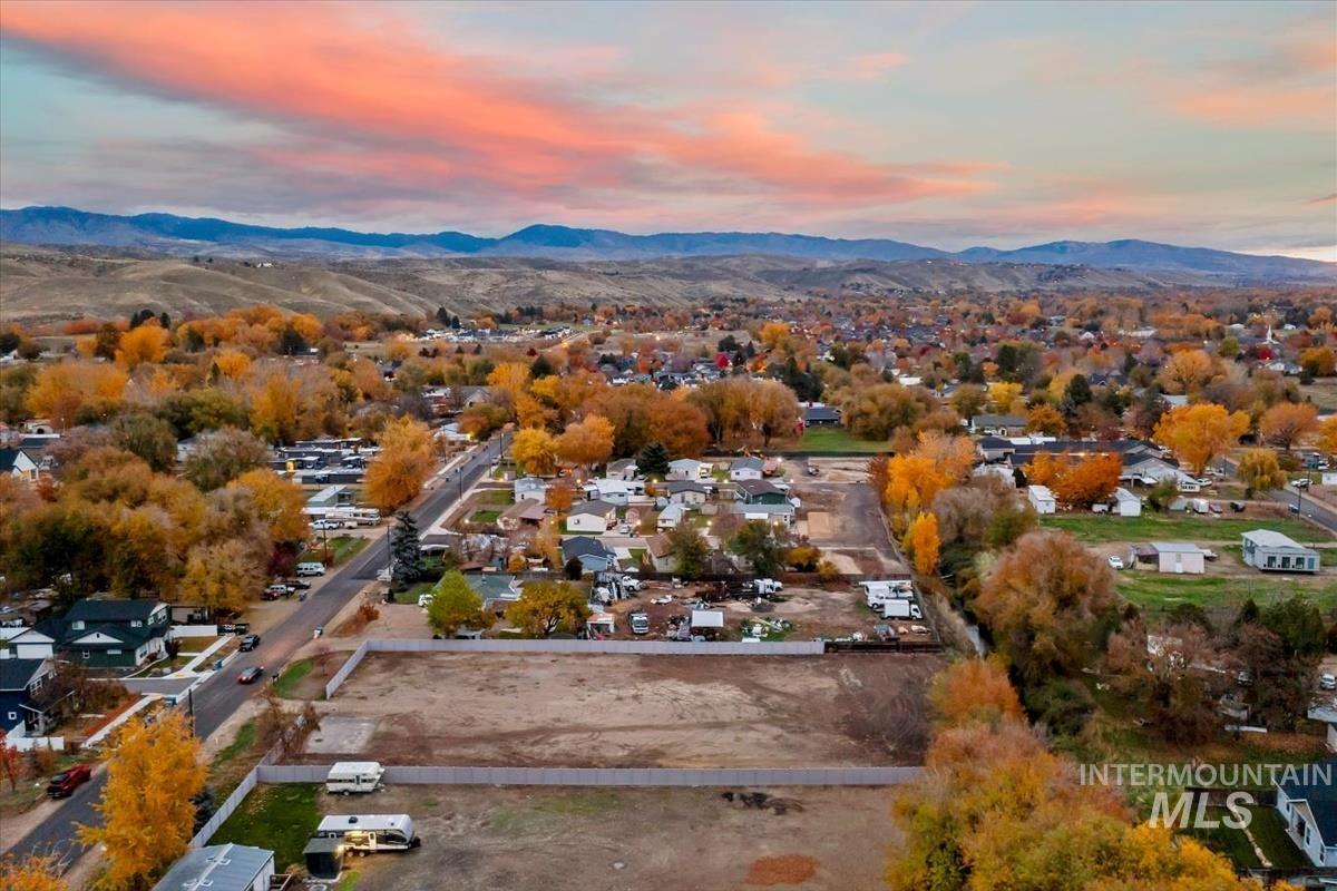 Aerial view of residential area featuring a mountain backdrop
