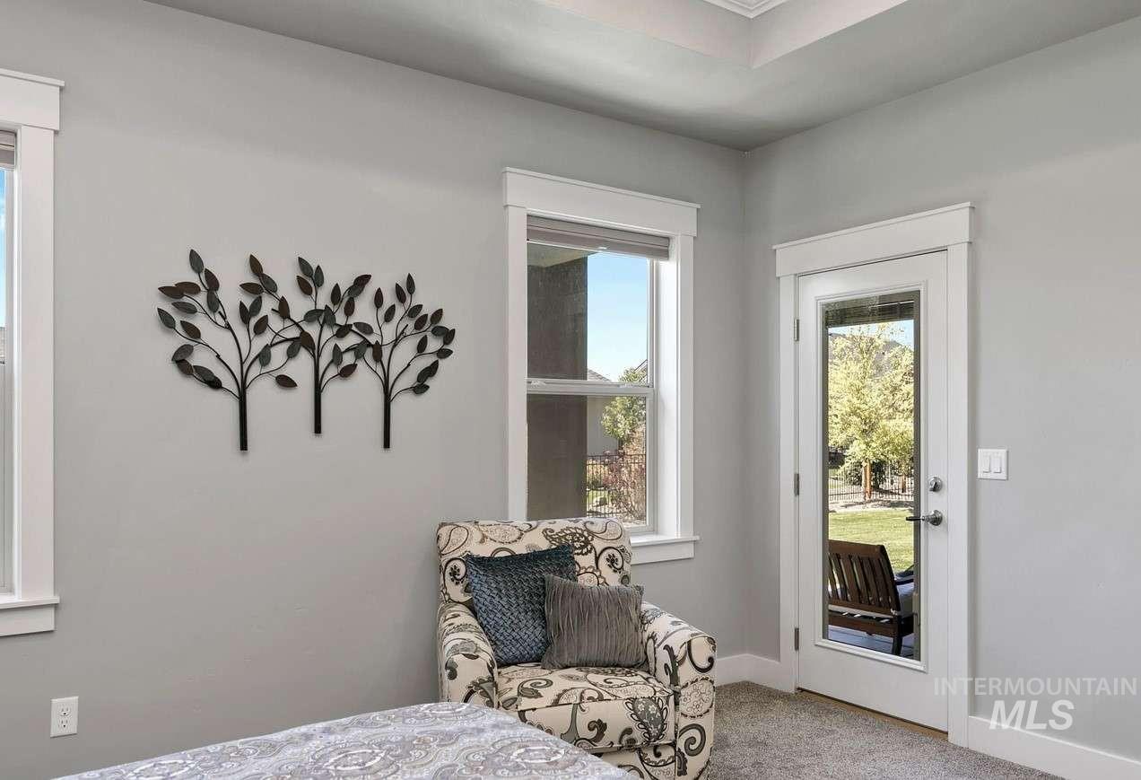 Bedroom featuring access to outside and light colored carpet