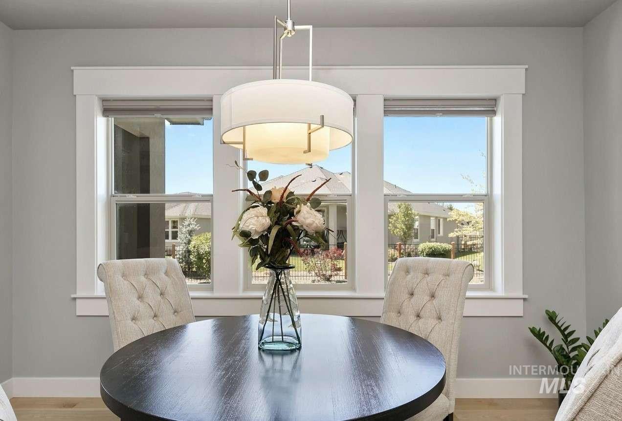Dining space featuring light wood-type flooring and healthy amount of natural light