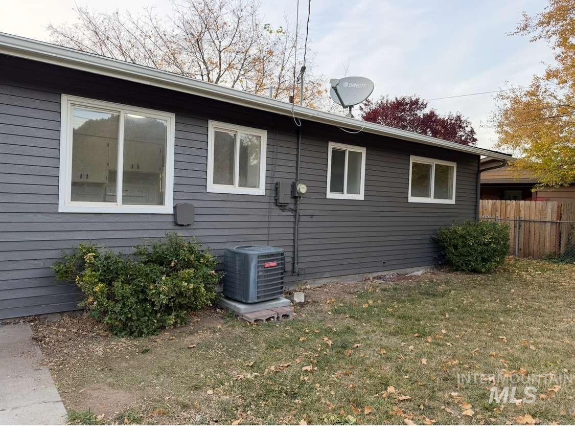 View of home's exterior featuring a cooling unit