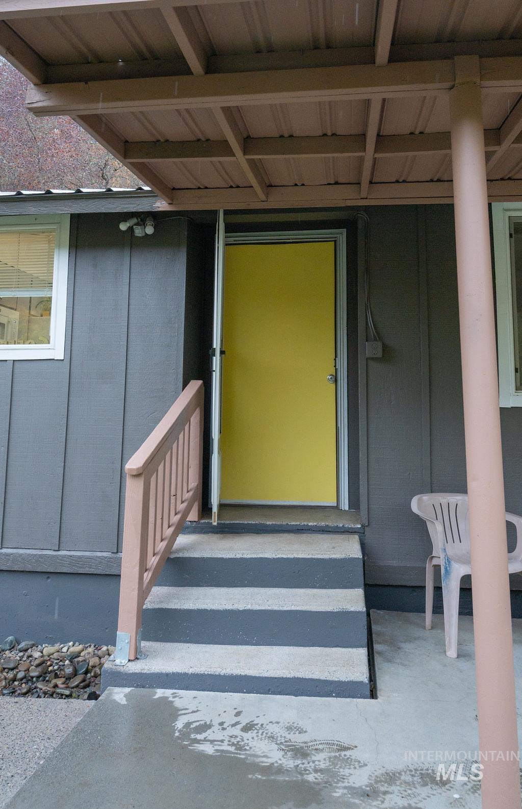 Doorway to property with board and batten siding