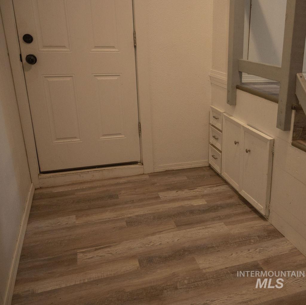 Hallway with light wood finished floors
