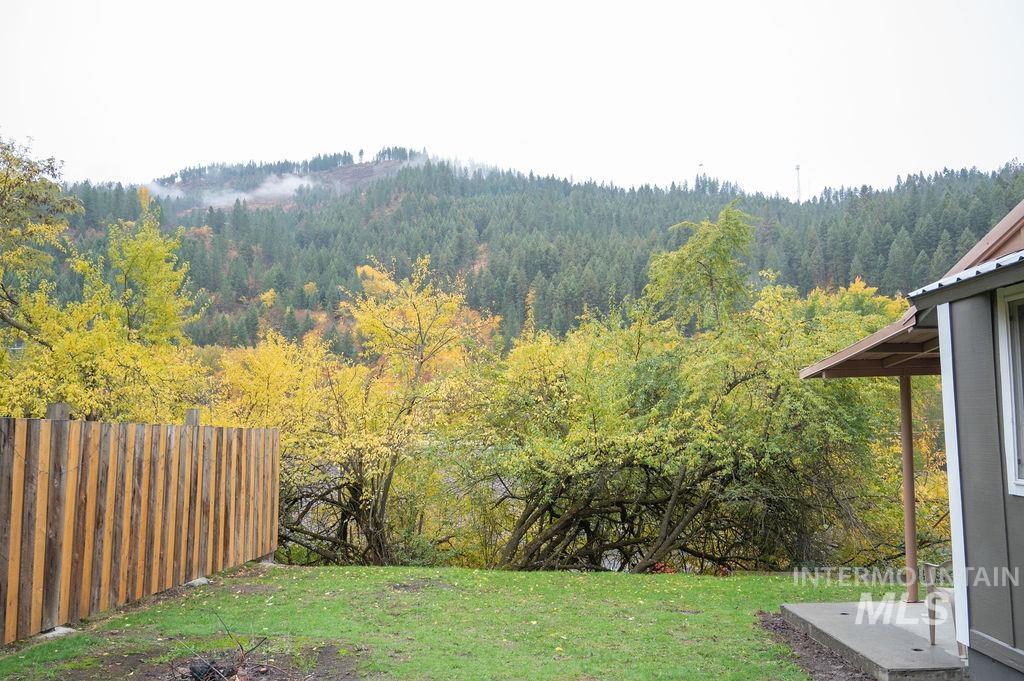 View of yard with a forest view
