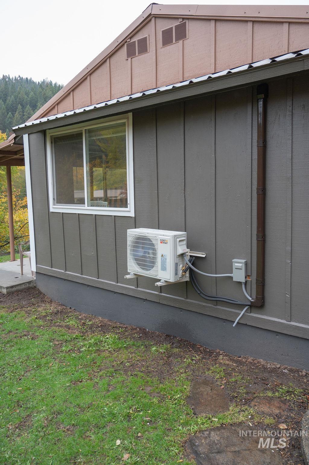 View of property exterior with board and batten siding