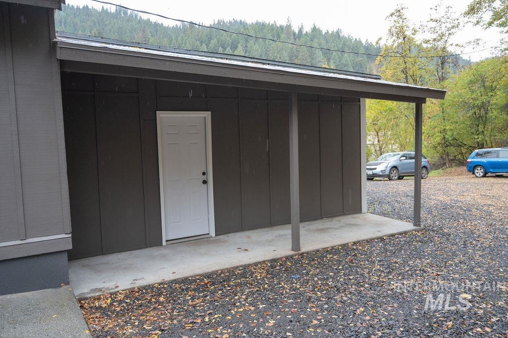 View of outbuilding featuring a forest view