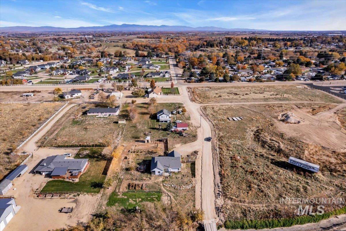 View of property location featuring nearby suburban area and a mountainous background