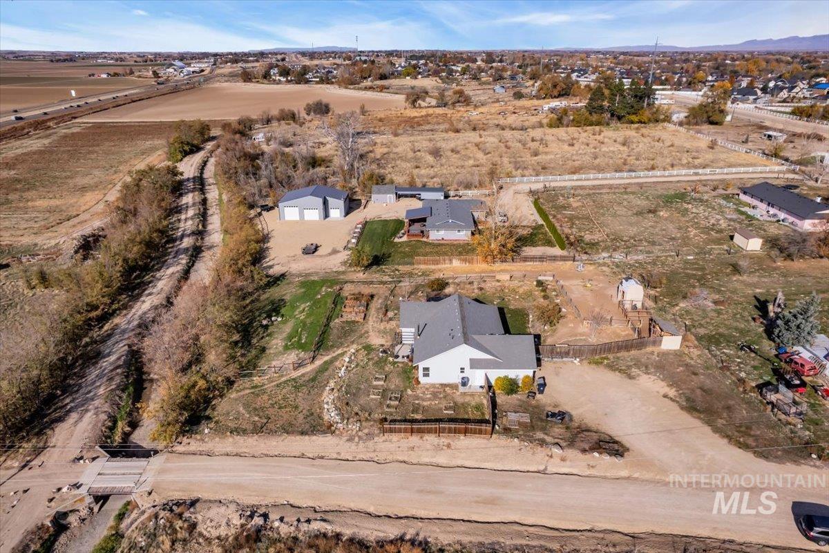 Aerial view of property and surrounding area with rural landscape