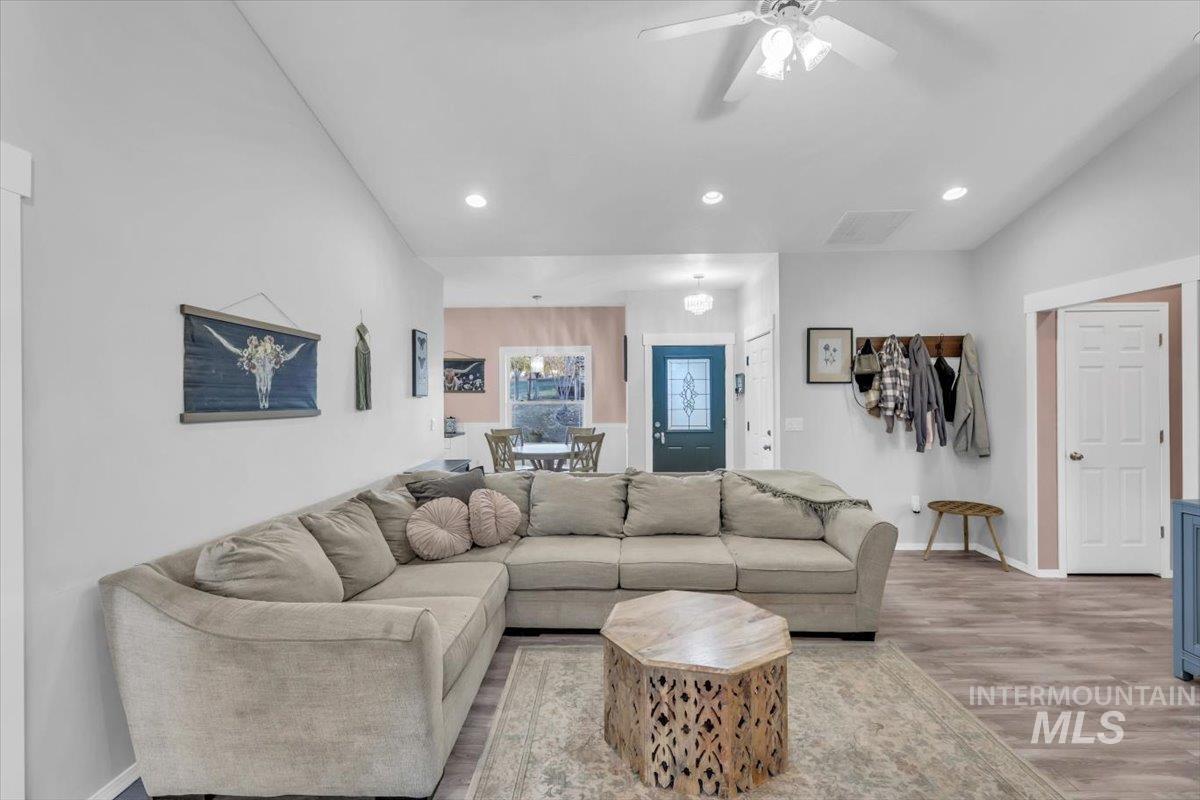 Living area featuring recessed lighting, wood finished floors, and a ceiling fan