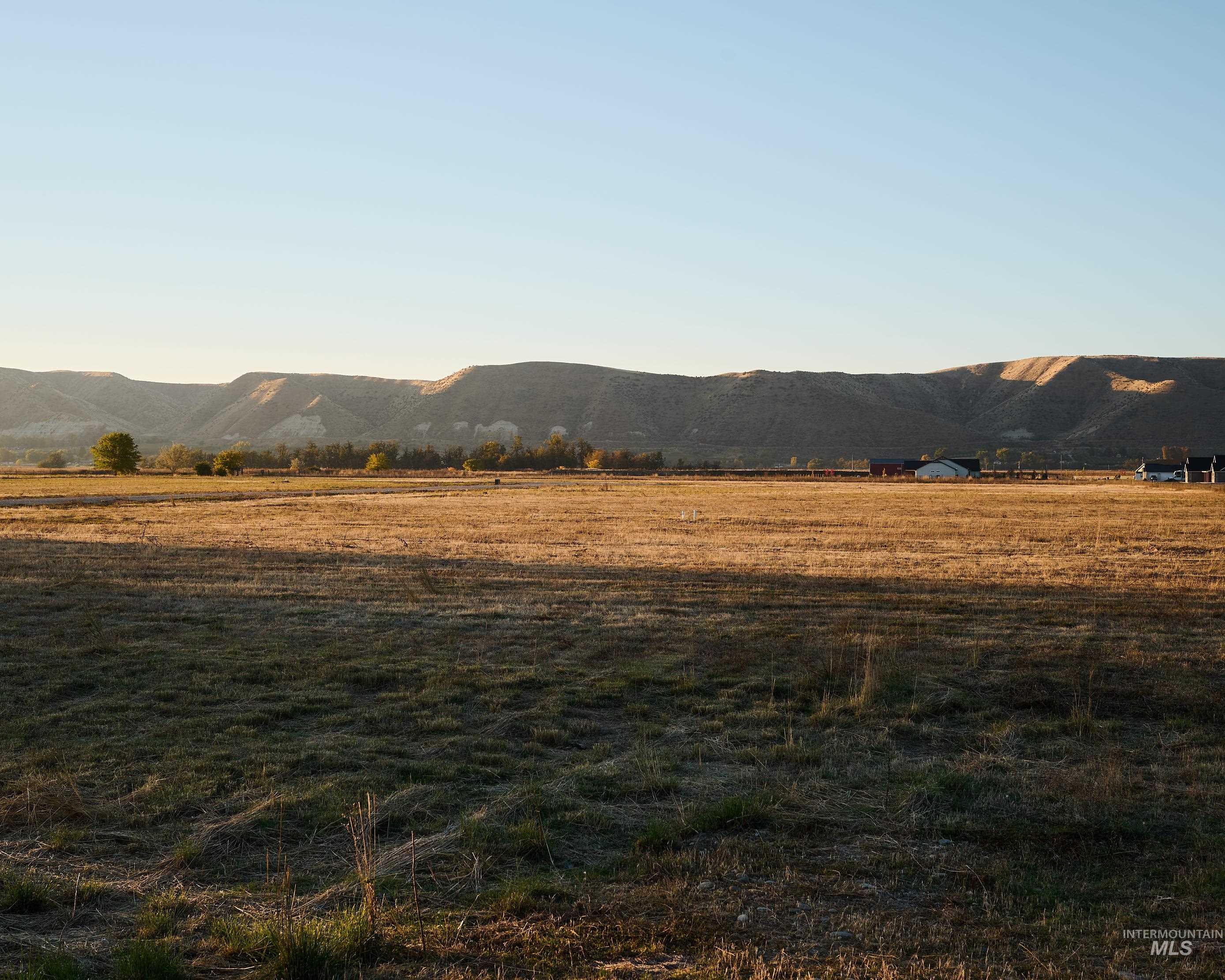 View of mountain background featuring rural landscape
