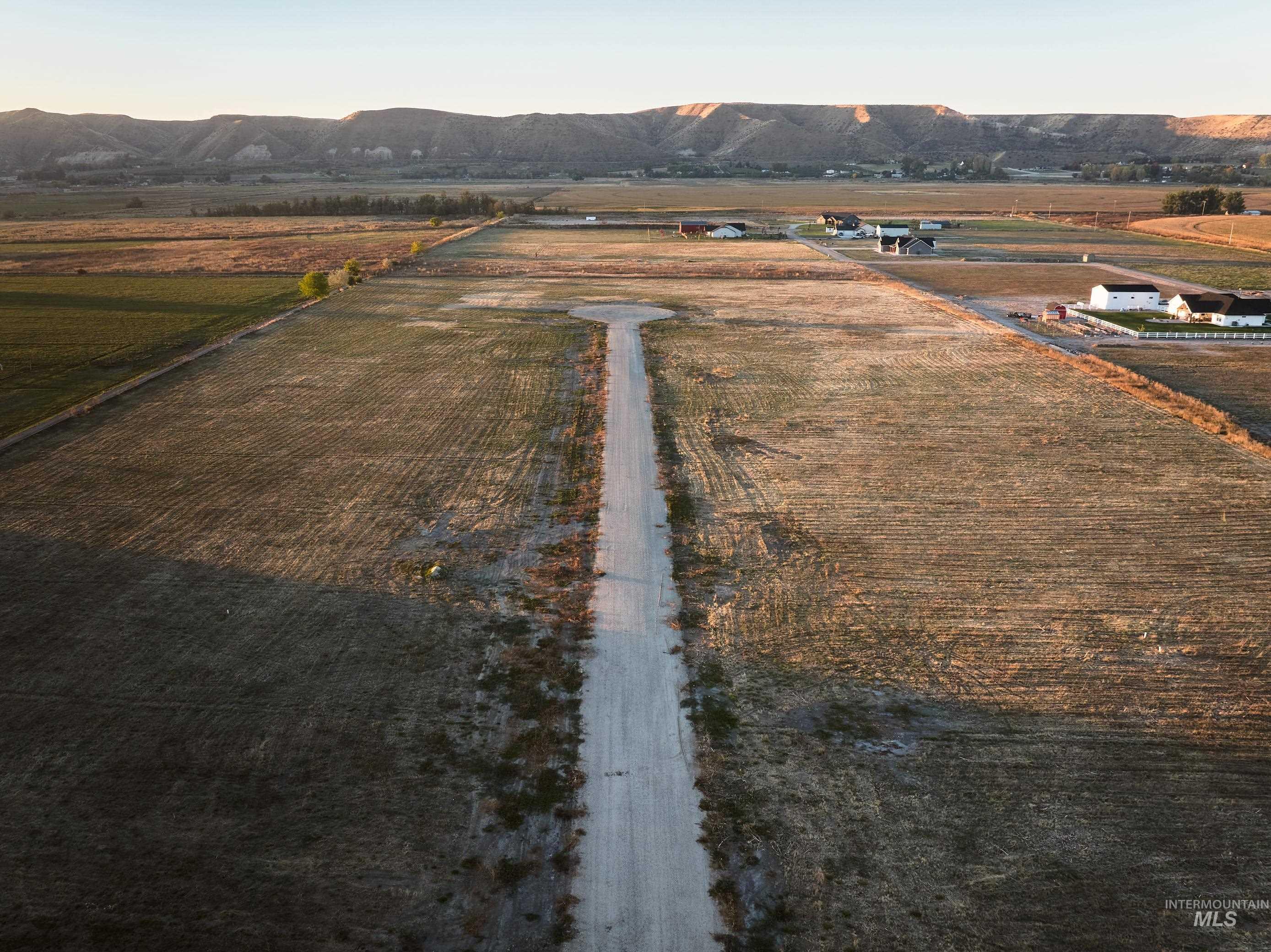 View of rural area featuring farmland and mountains