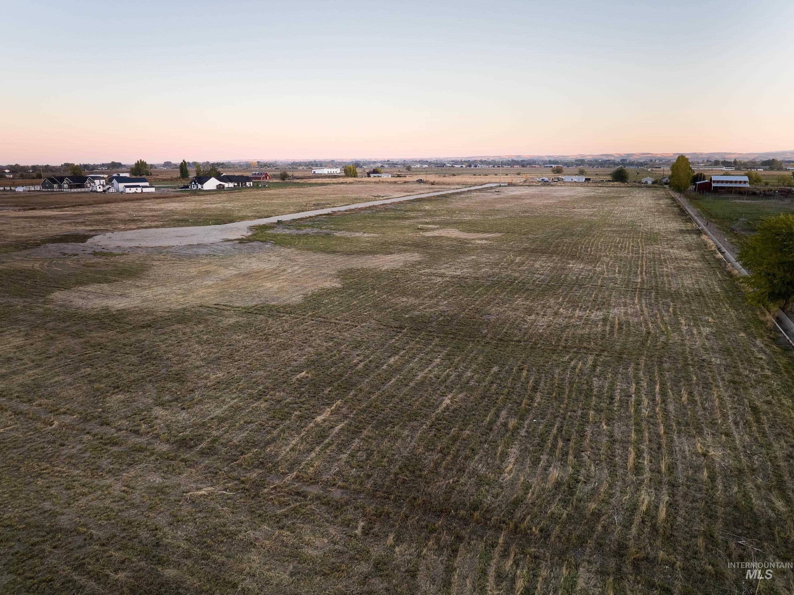 View of rural area featuring large plots for crops