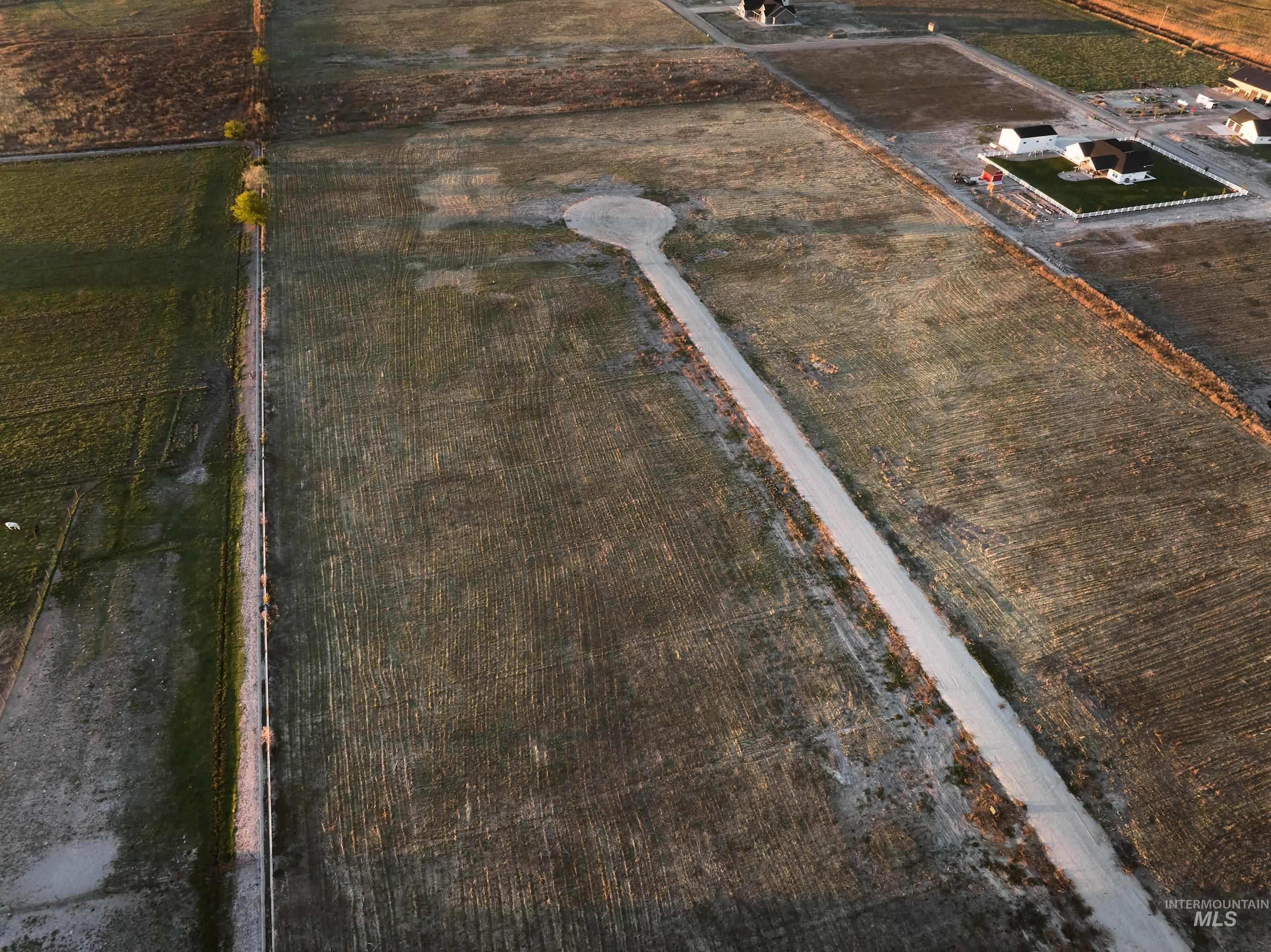Aerial view of sparsely populated area featuring extensive farmland