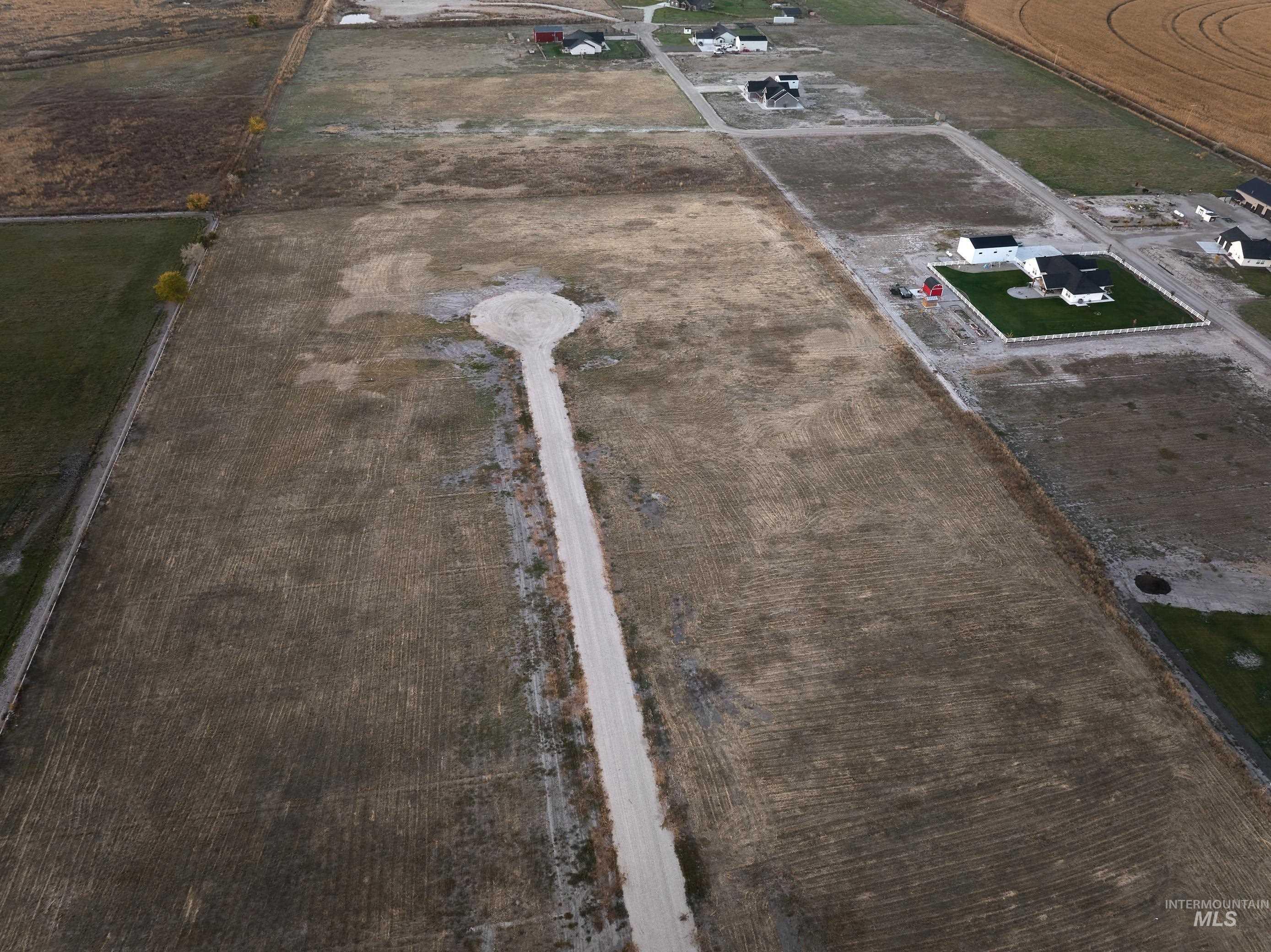 Aerial view of property and surrounding area featuring rural landscape