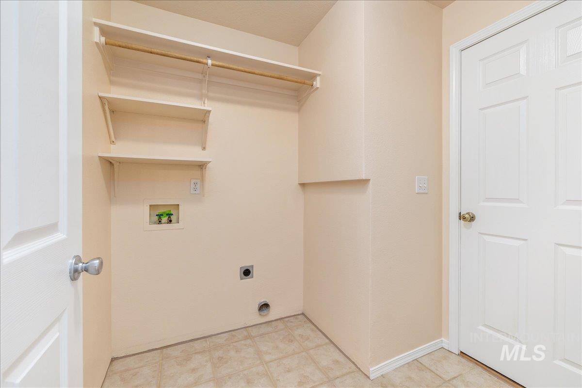 Laundry area featuring electric dryer hookup and hookup for a washing machine