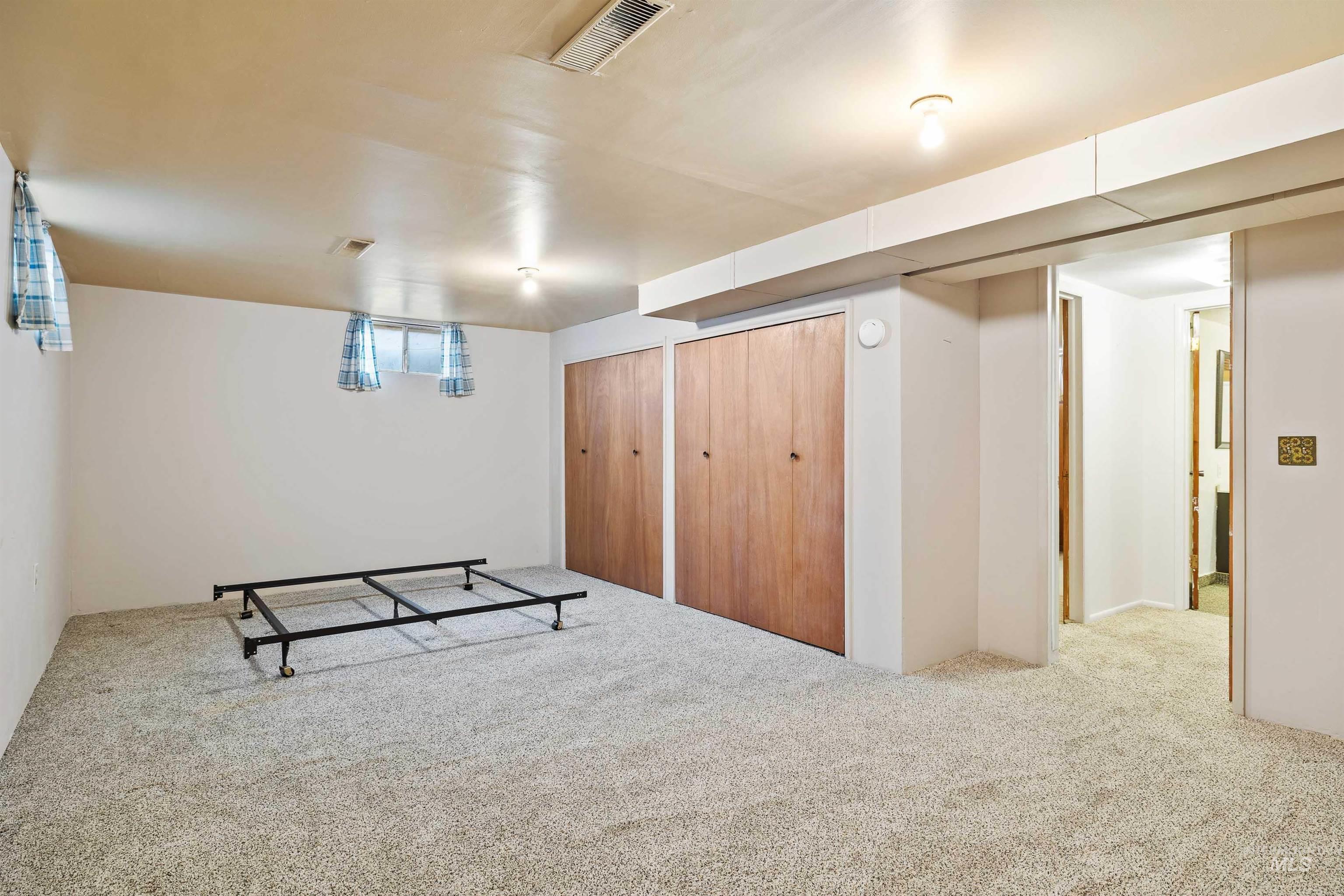 Basement with carpet flooring