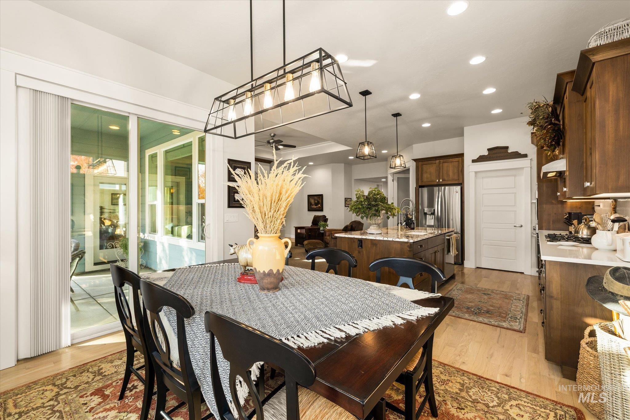 Dining area featuring light wood-style flooring and recessed lighting