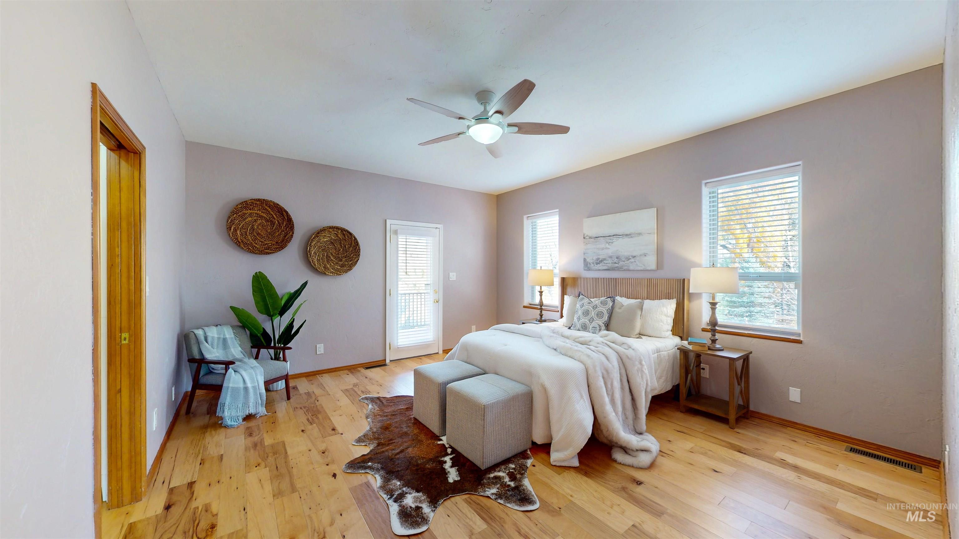 Bedroom featuring light wood flooring and a ceiling fan