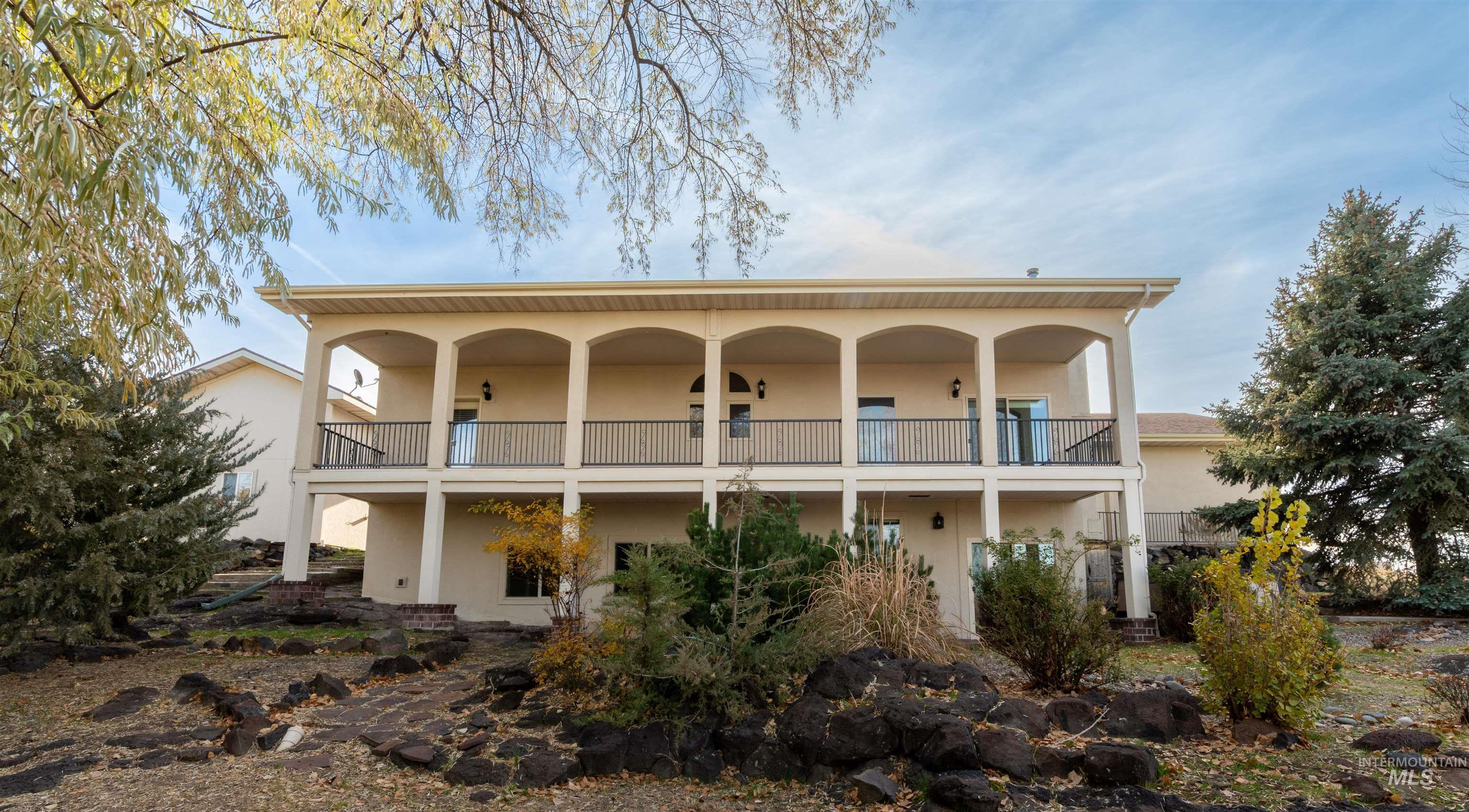 Rear view of property with stucco siding