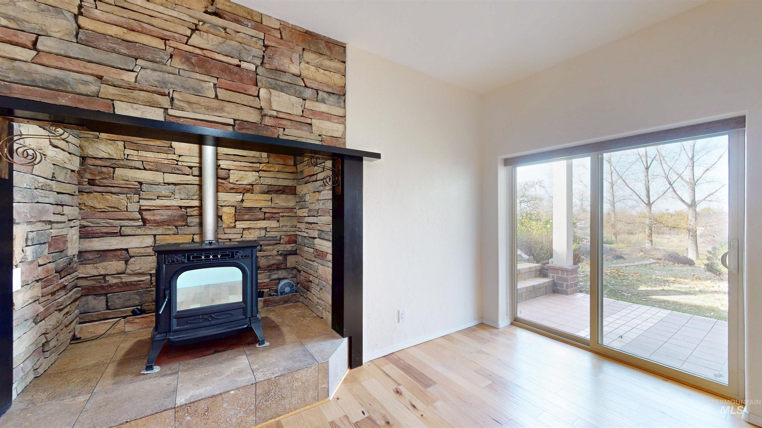 Detailed view of a wood stove and wood finished floors