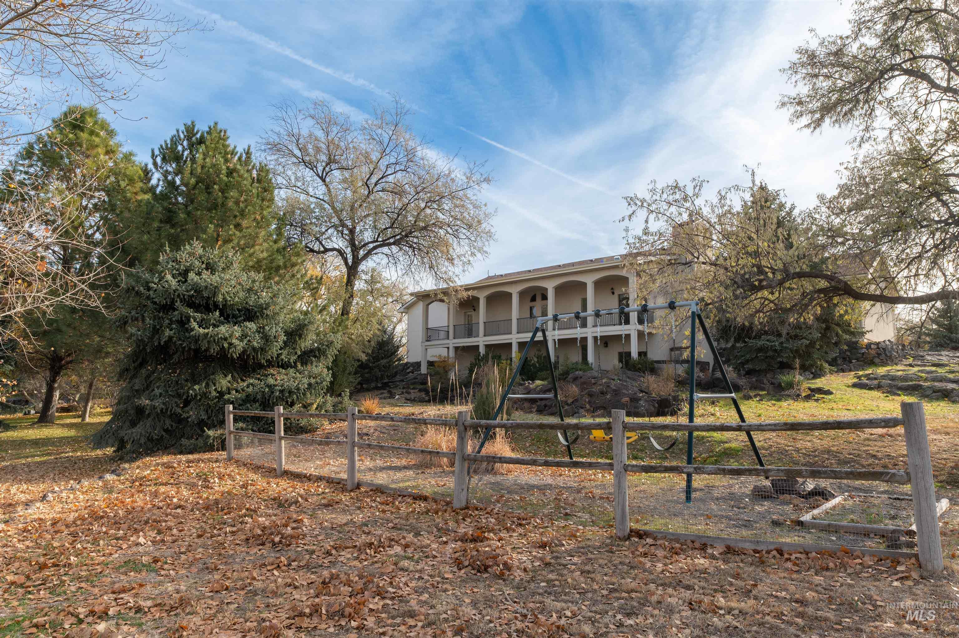 Rear view of property featuring stucco siding