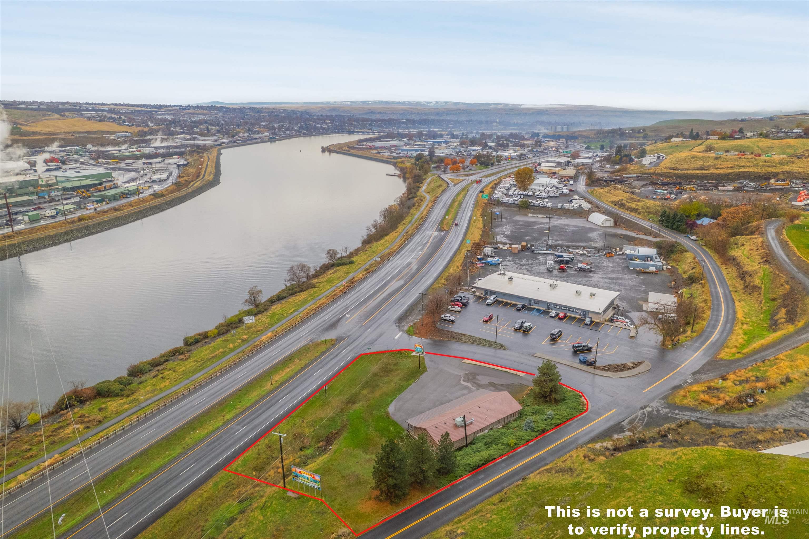 View of property location with property parcel outlined and a nearby body of water