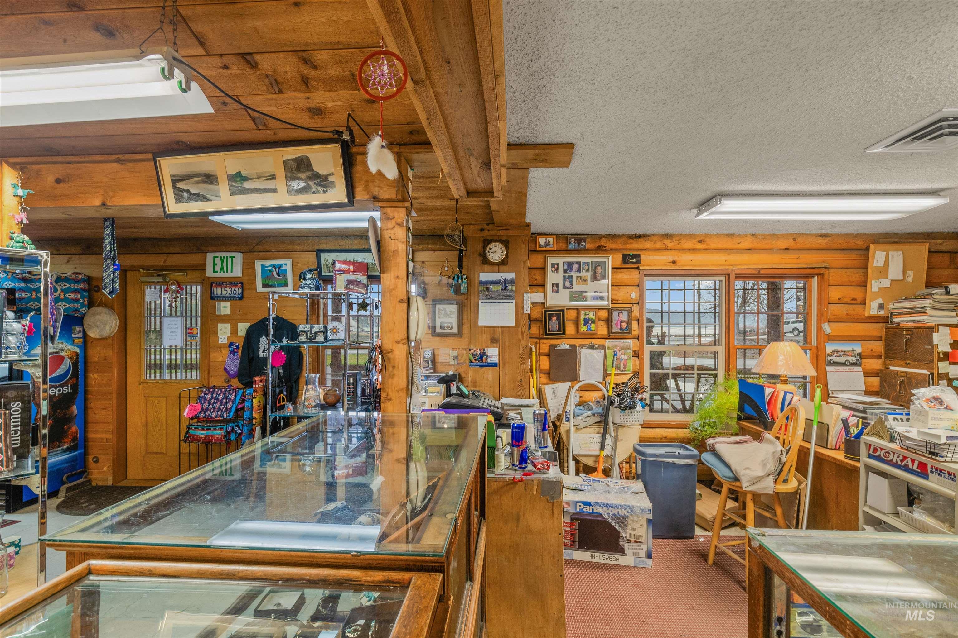 Misc room featuring wood walls and a textured ceiling