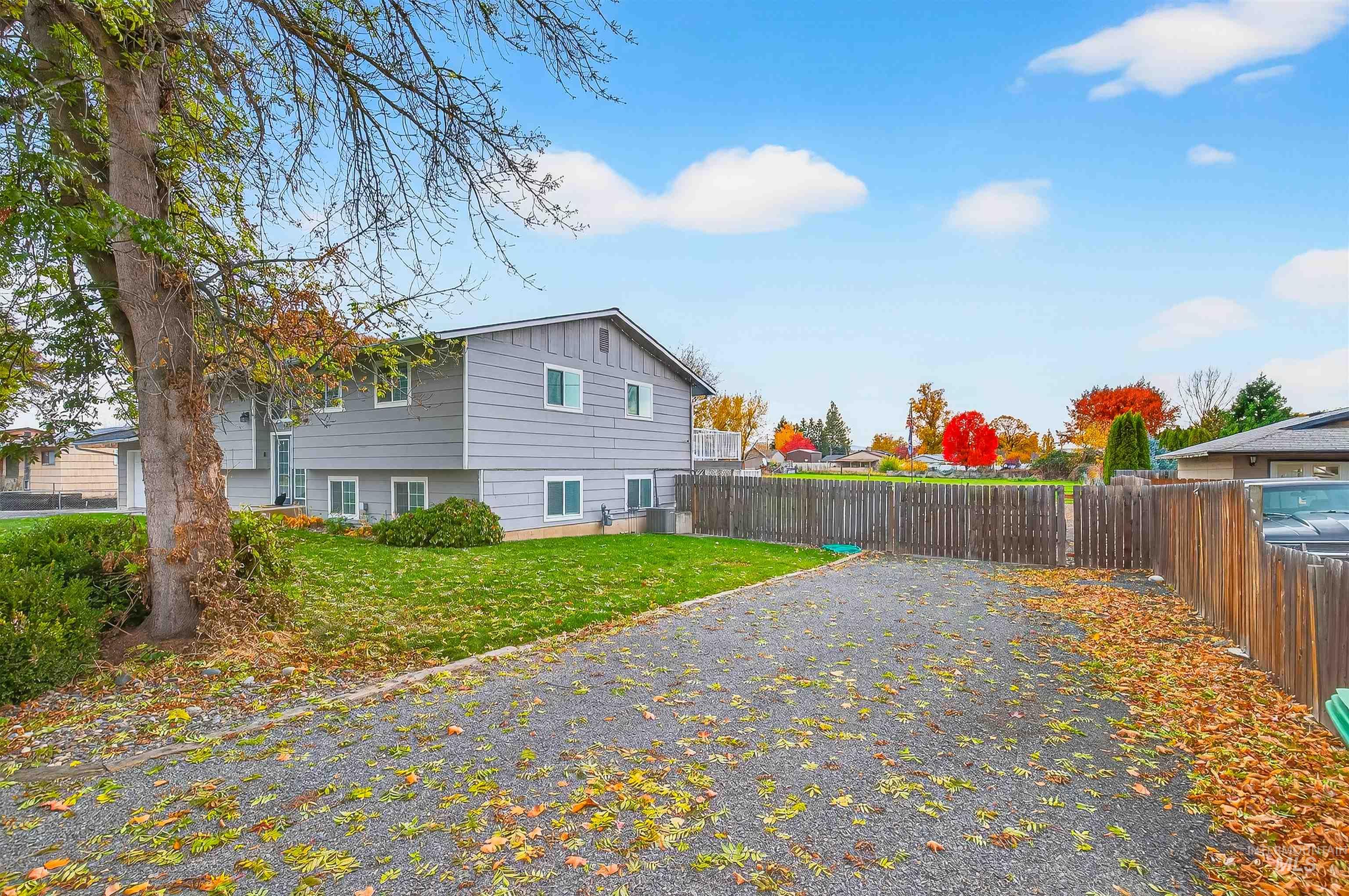 View of home's exterior featuring a fenced backyard and board and batten siding