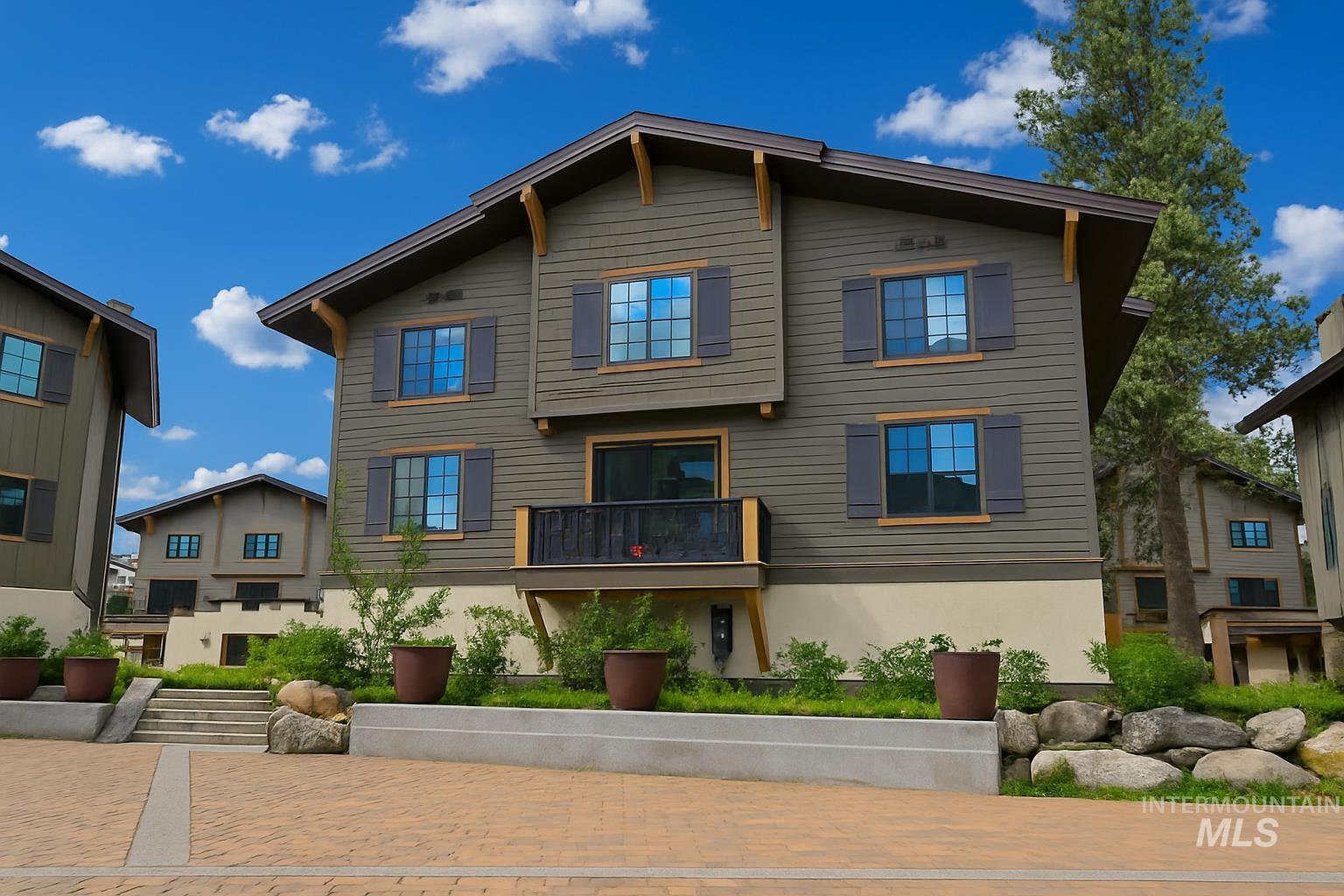 View of front of property featuring a balcony