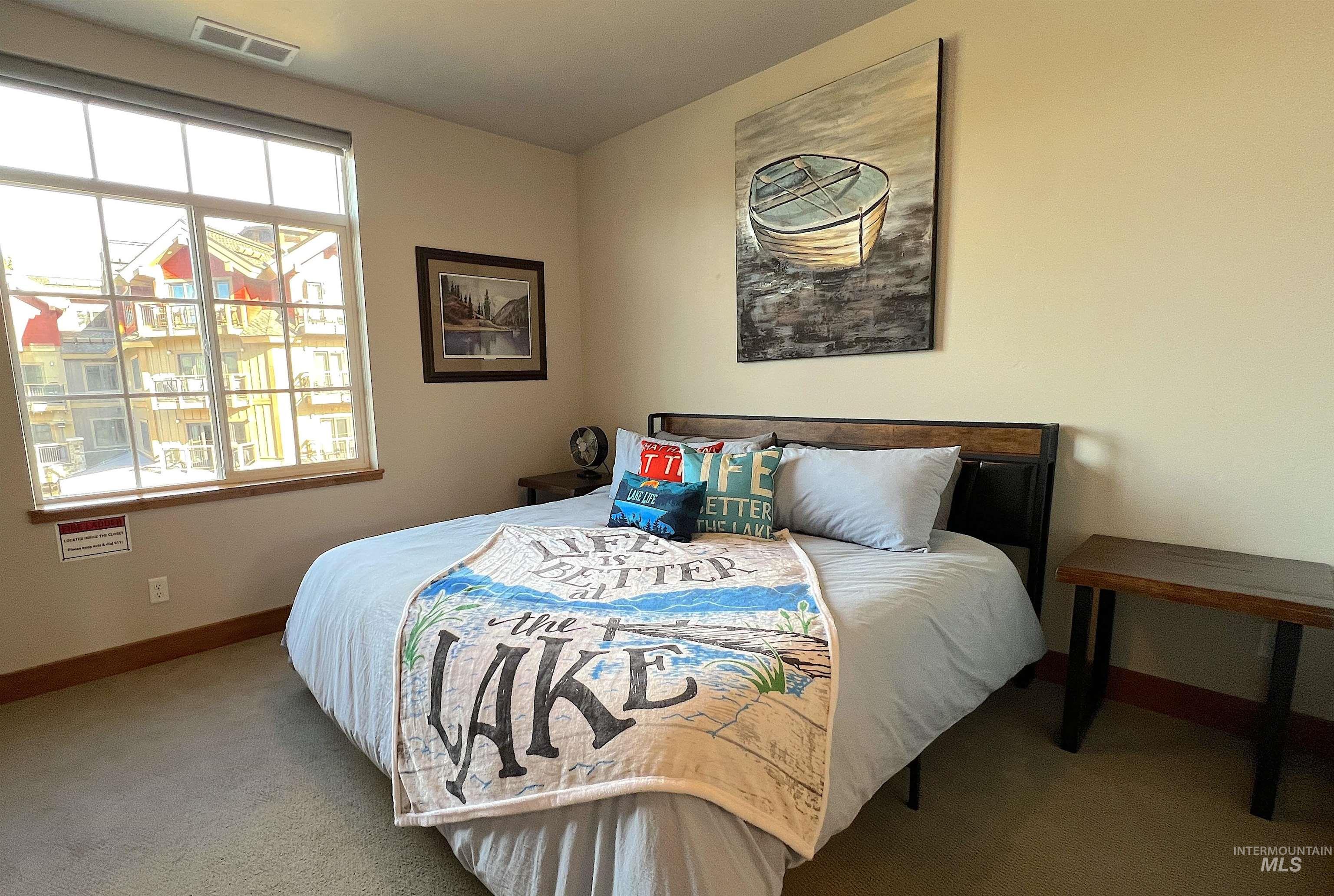 Carpeted bedroom with baseboards