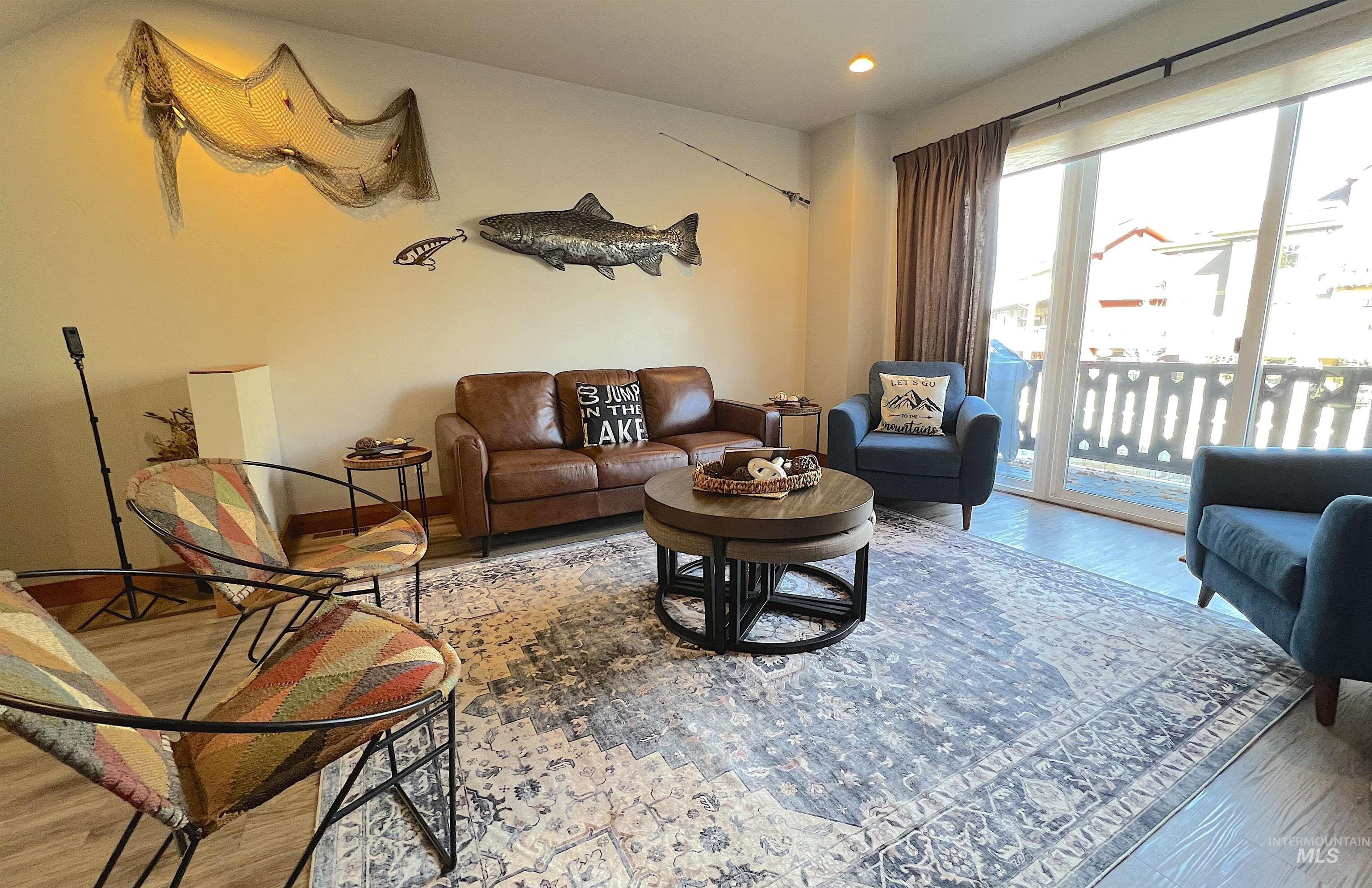 Living room featuring wood finished floors and recessed lighting
