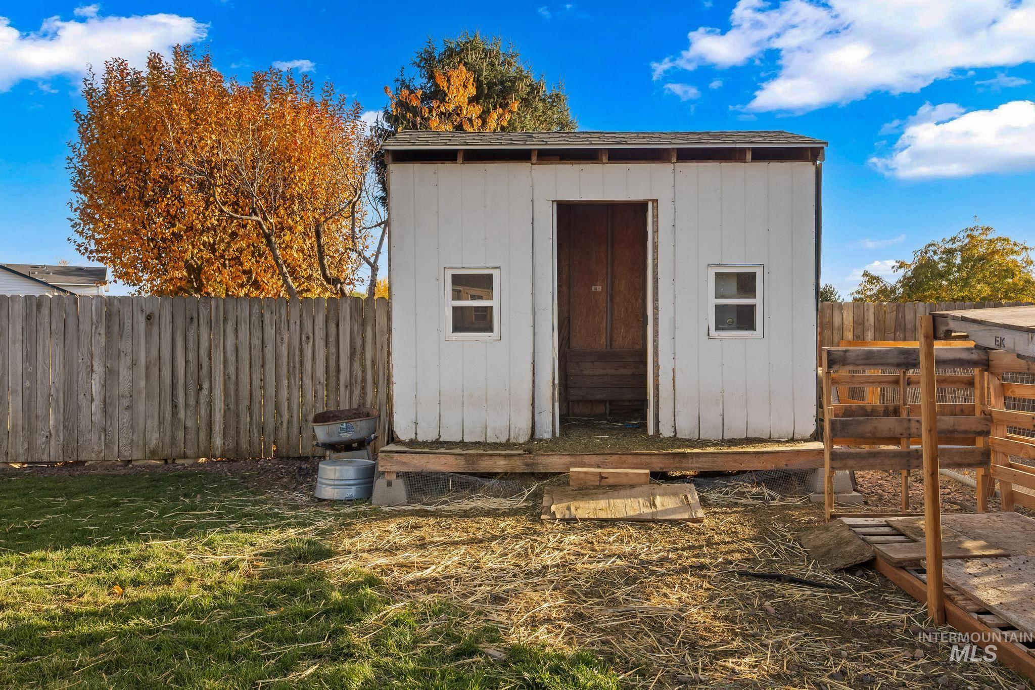 View of shed featuring a fenced backyard